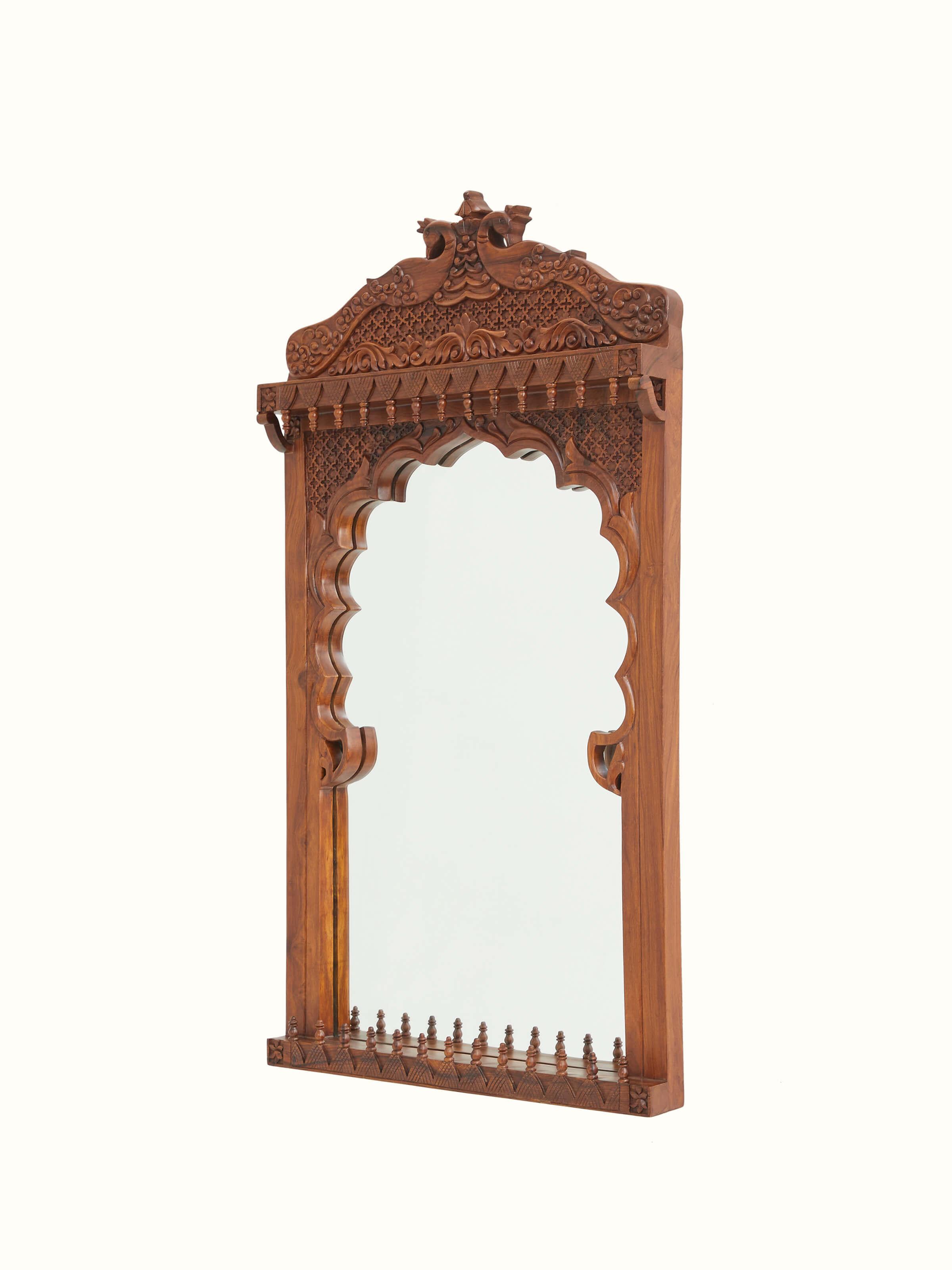 Close-up of the mirror and carved frame on the dressing table set