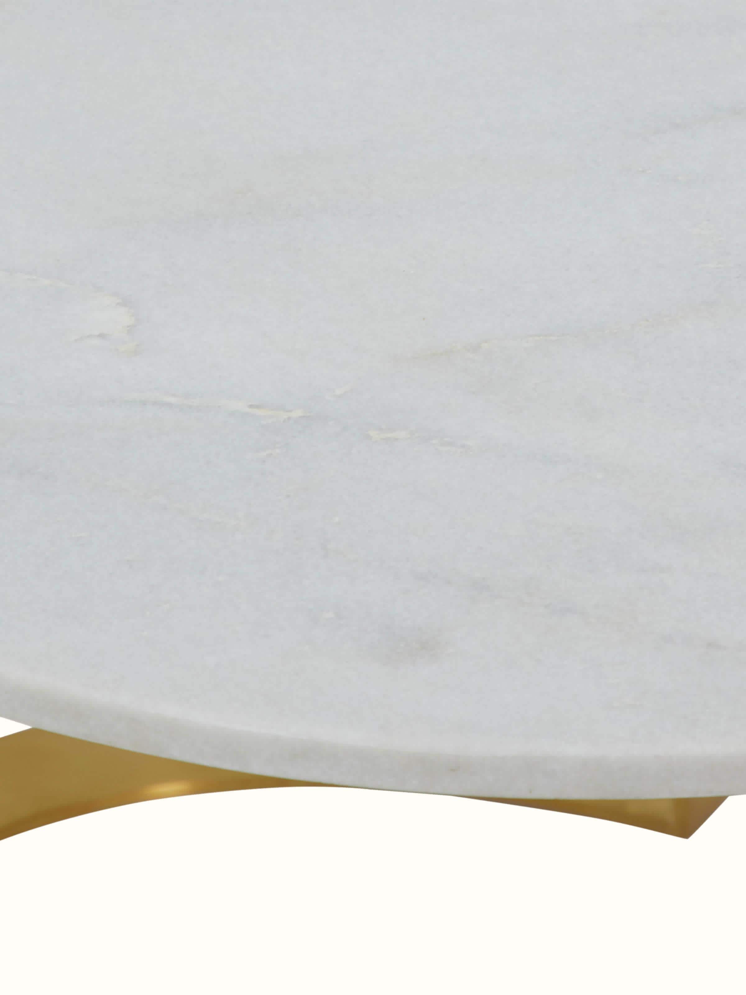 Close-up of Carved Metal & Marble Top Coffee Table focusing on the detailed craftsmanship of the carvings