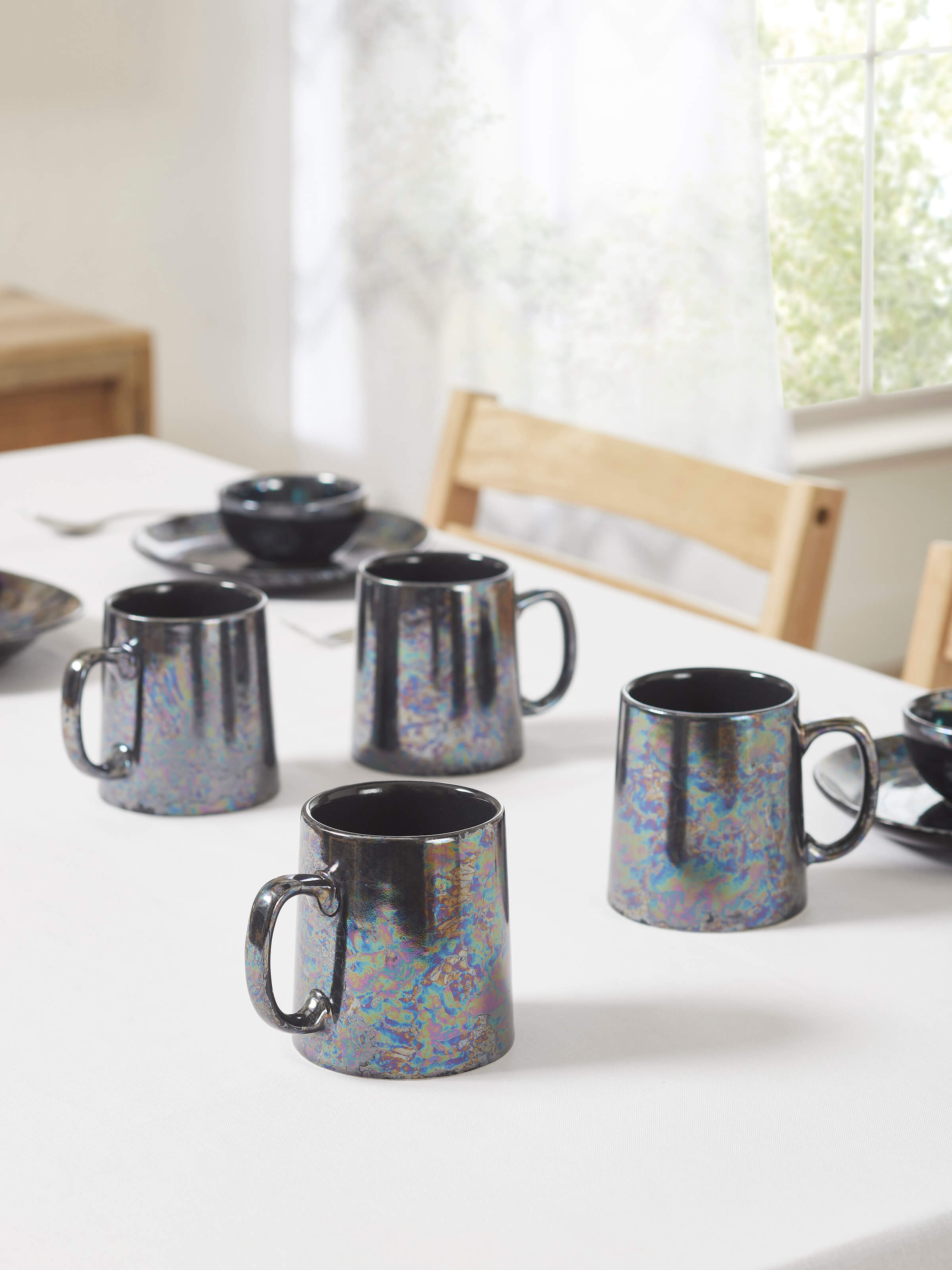Side view of Khurja Pottery Ceramic Coffee Mugs in black (4 pcs) highlighting the design and shape.