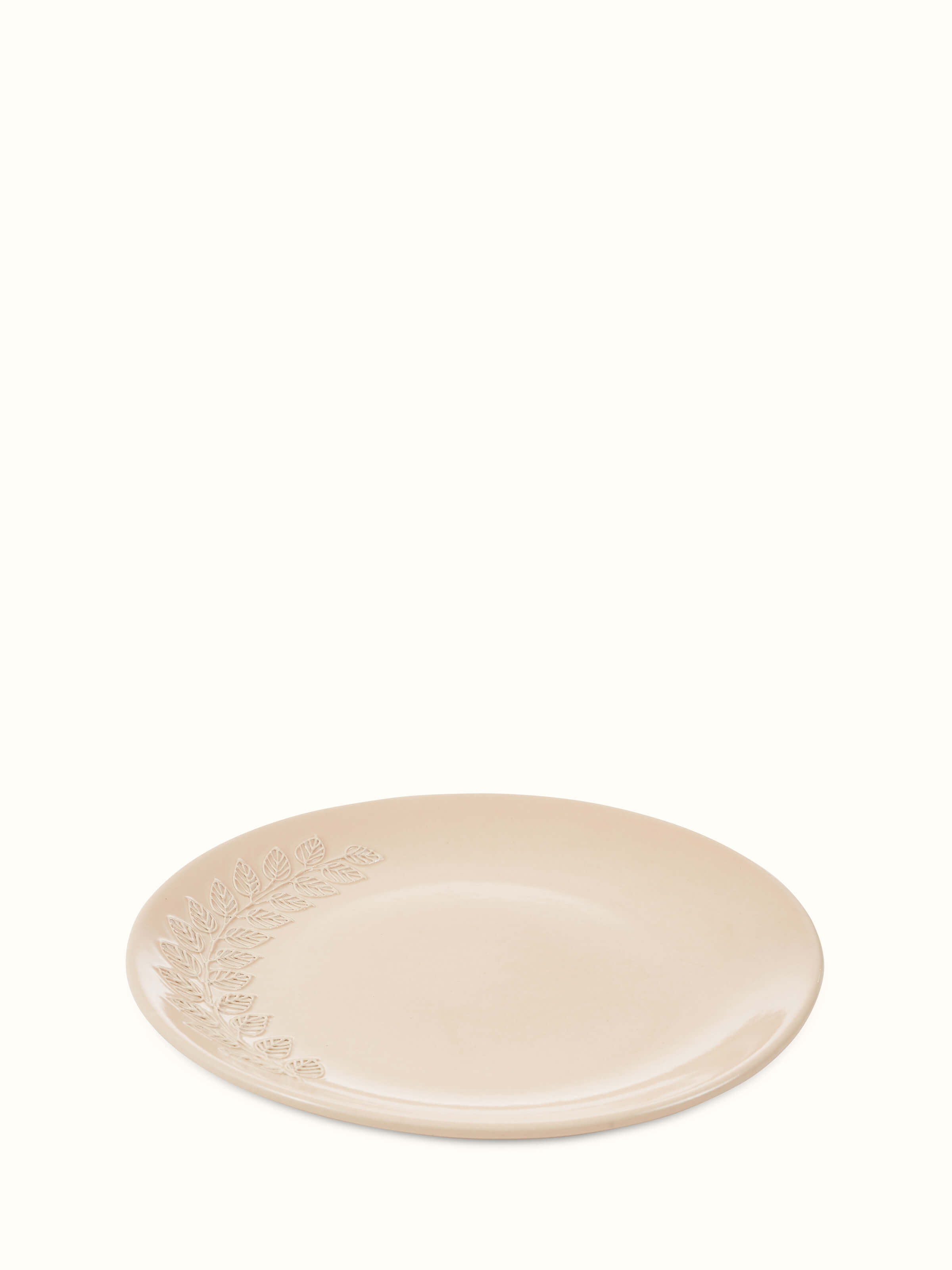 Angled view of Khurja Pottery Ceramic Dinner Plates in Pink, emphasizing the smooth curve and vibrant color