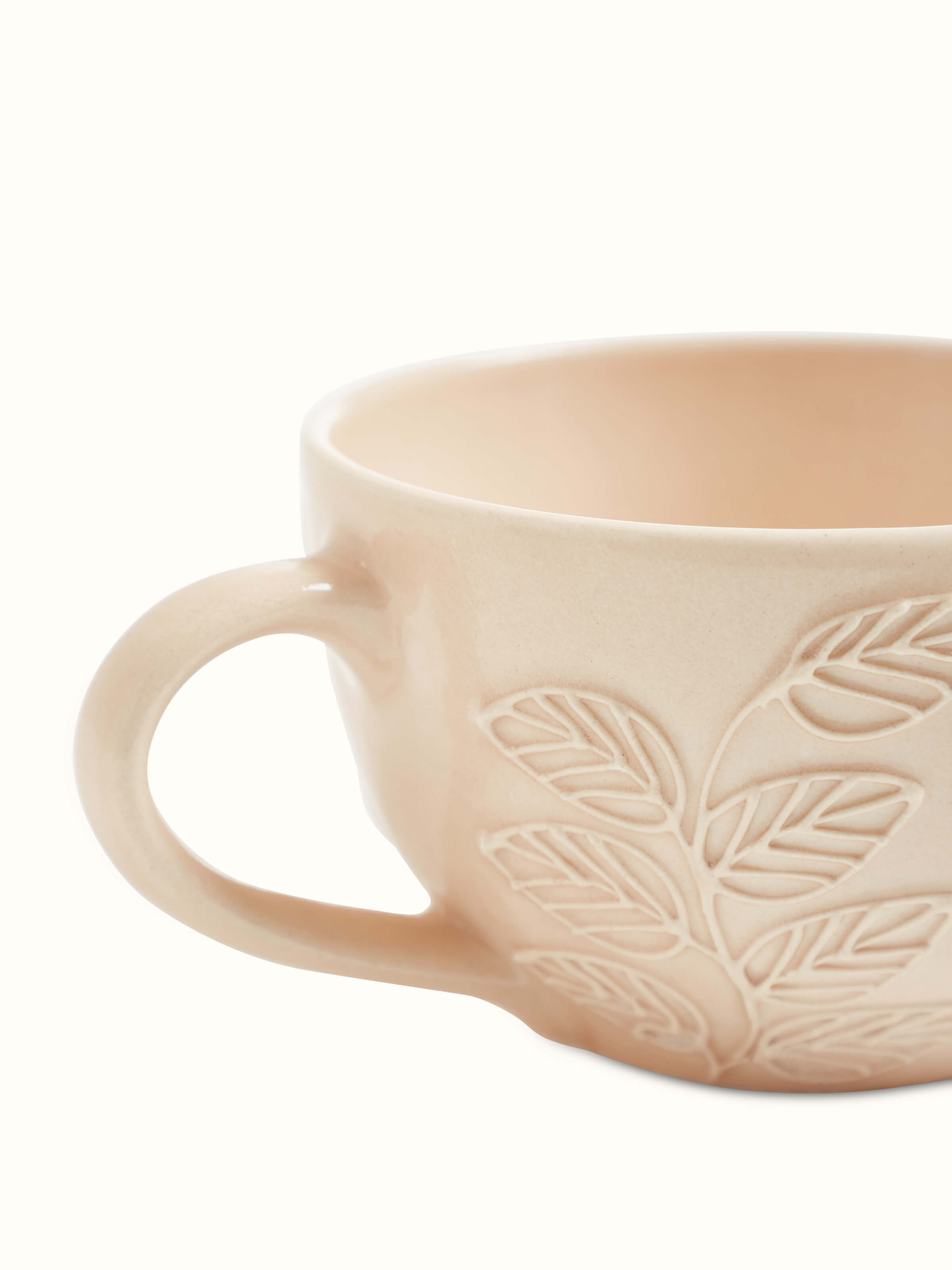 Angle view of pink Khurja pottery ceramic coffee mugs set of 4