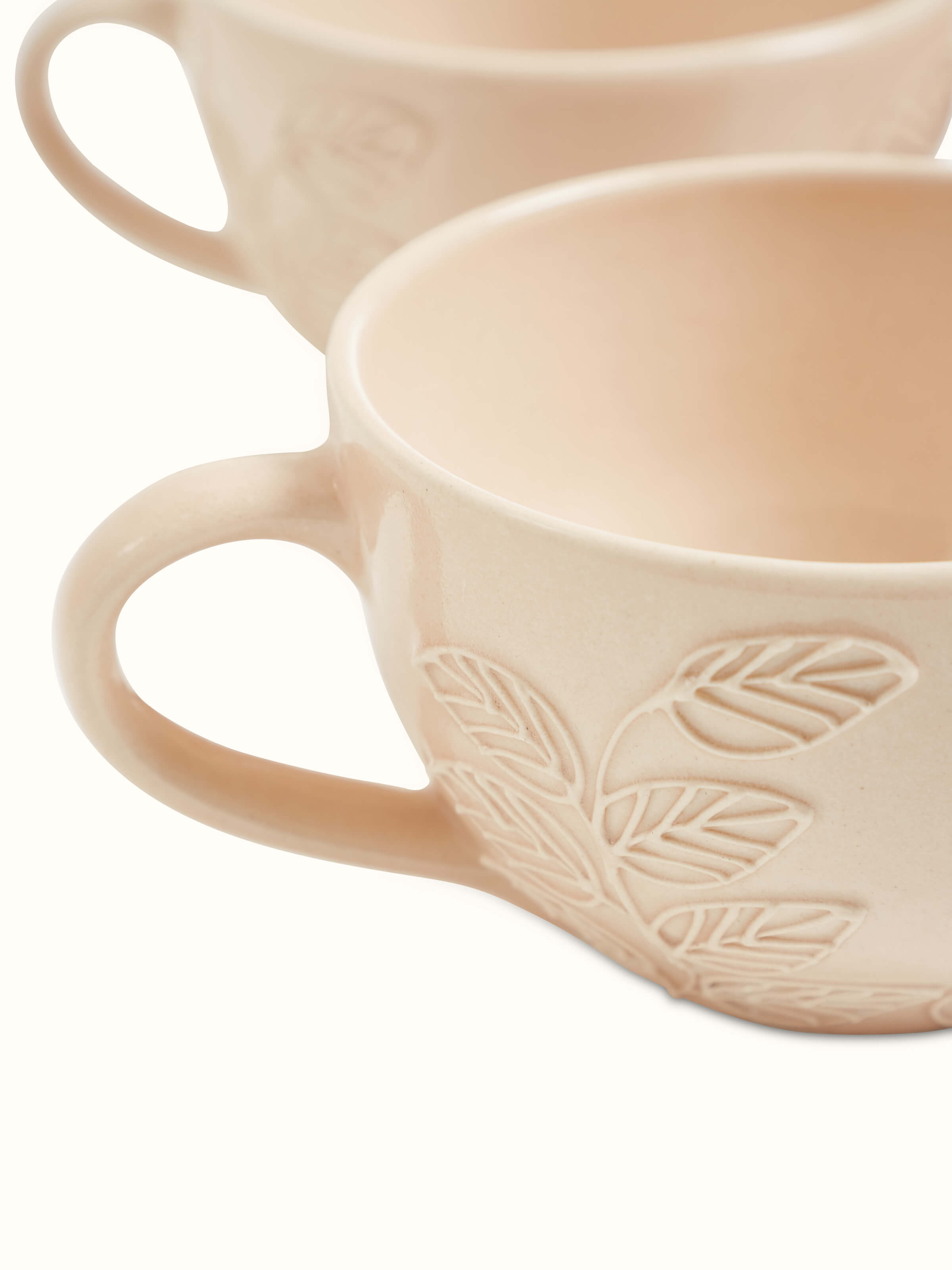 Side angle view of pink Khurja pottery ceramic coffee mugs set of 4