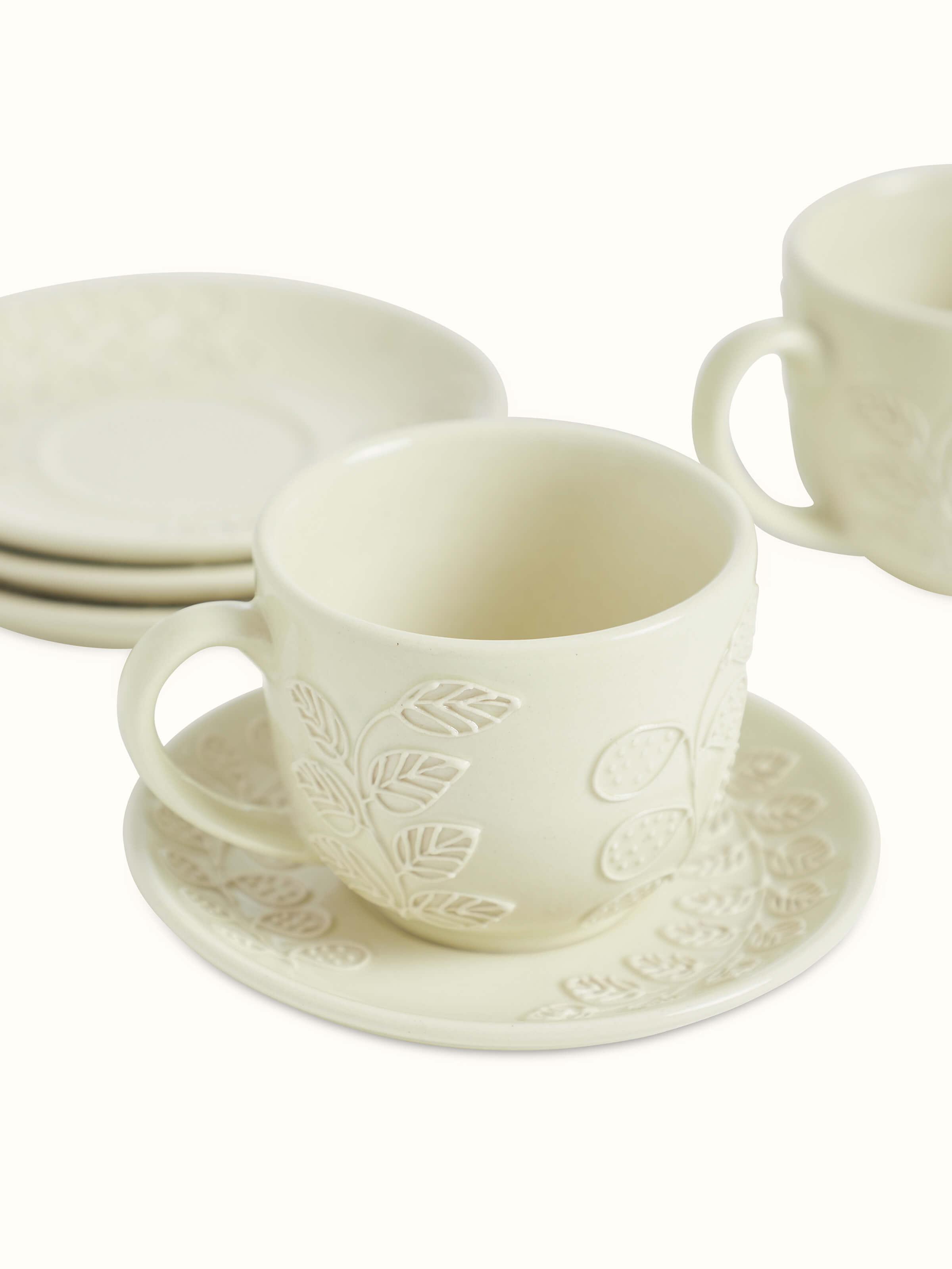 Back view of Khurja pottery ceramic teacup & saucer set (4 pcs) with emphasis on the fine craftsmanship