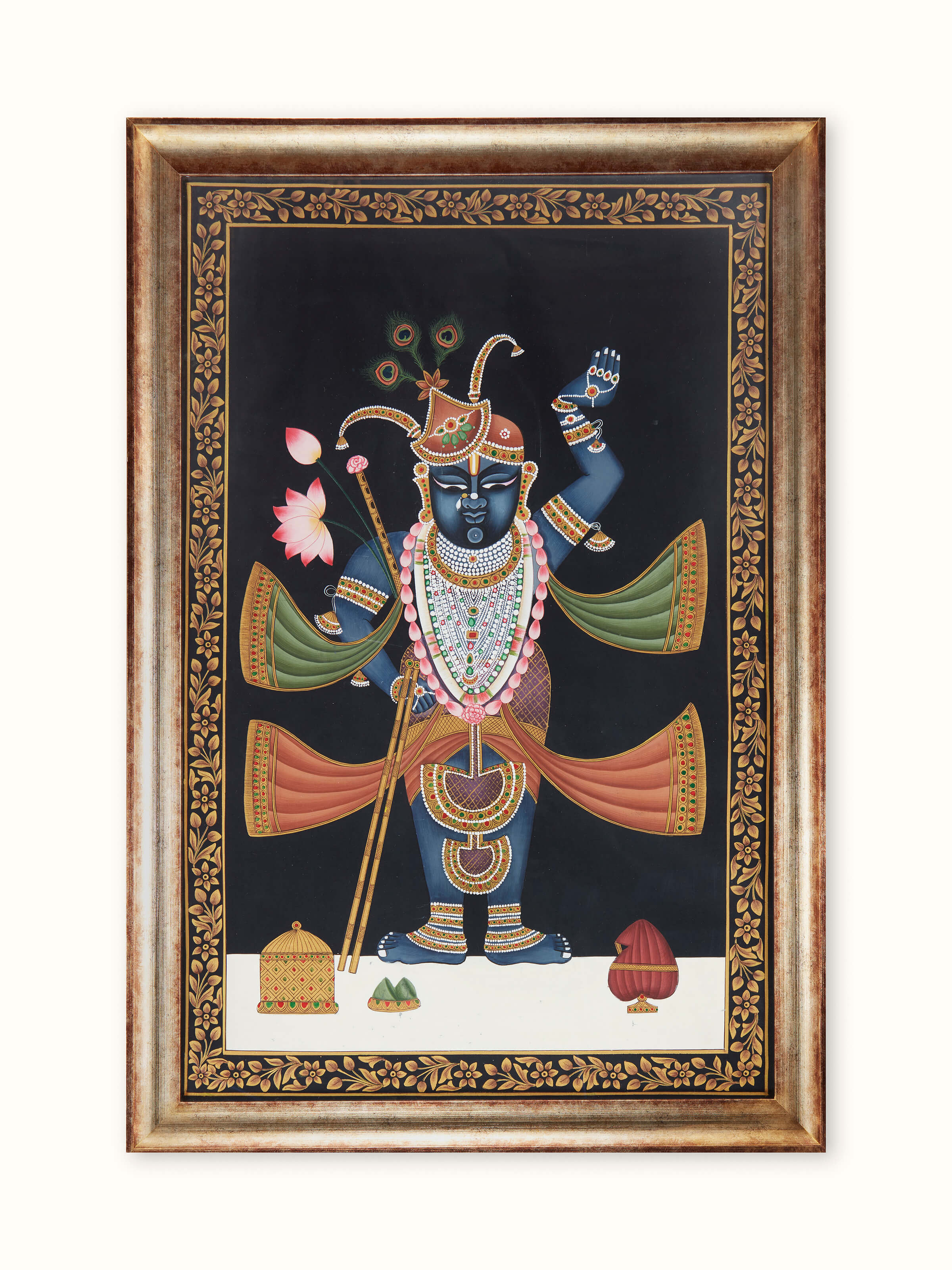 Pichwai Shreenathji painting featuring intricate details and vibrant colors depicting the revered deity Shreenathji.