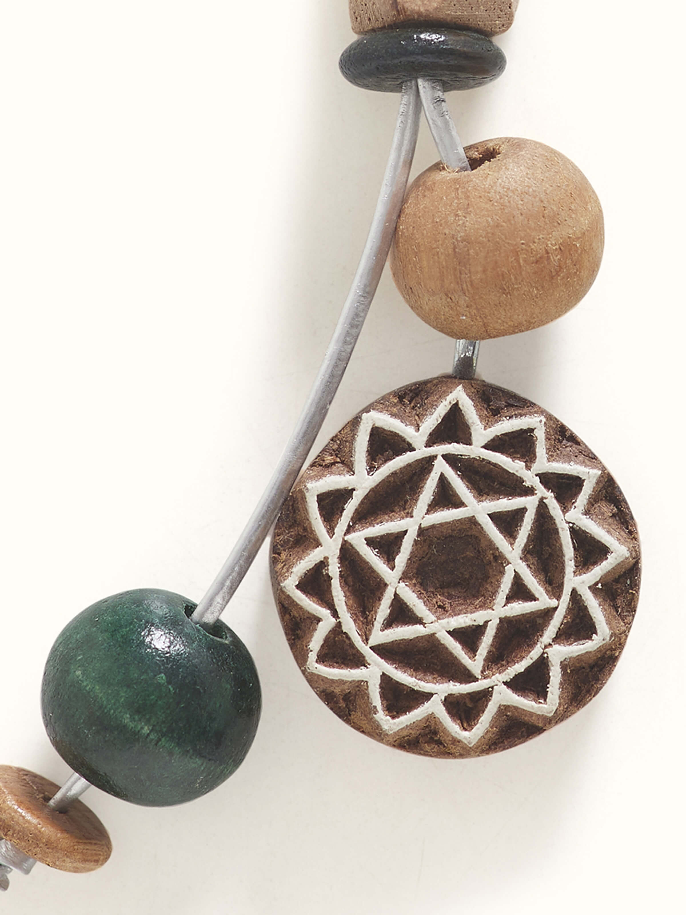 Another angle of brown block-making wooden keychain, focusing on its fine craftsmanship.