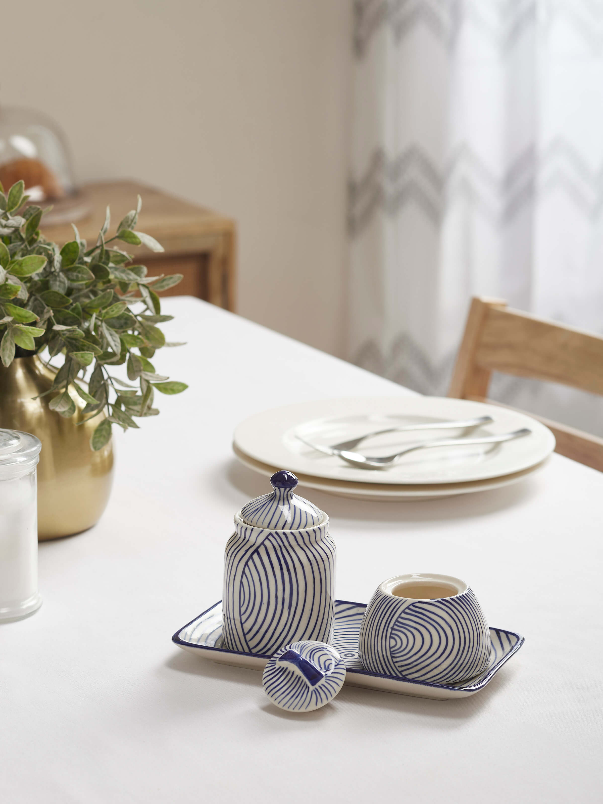 Close-up of Khurja pottery stoneware demitasse cups, highlighting their traditional design and detailed glaze.