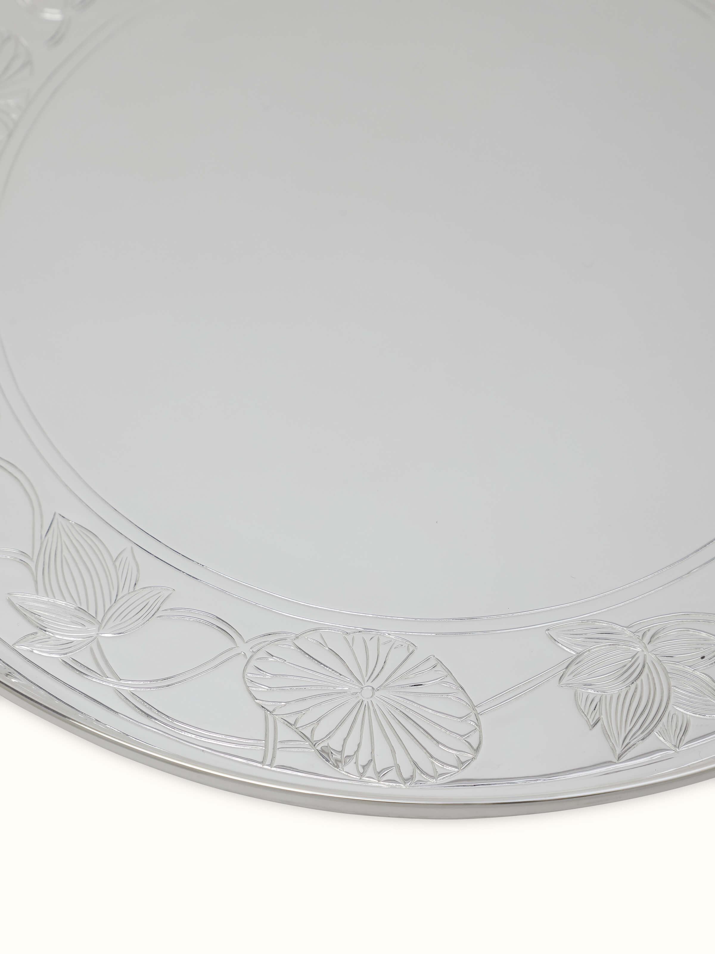 Angled view of Silver Lotus Dinner Plate focusing on its unique pattern