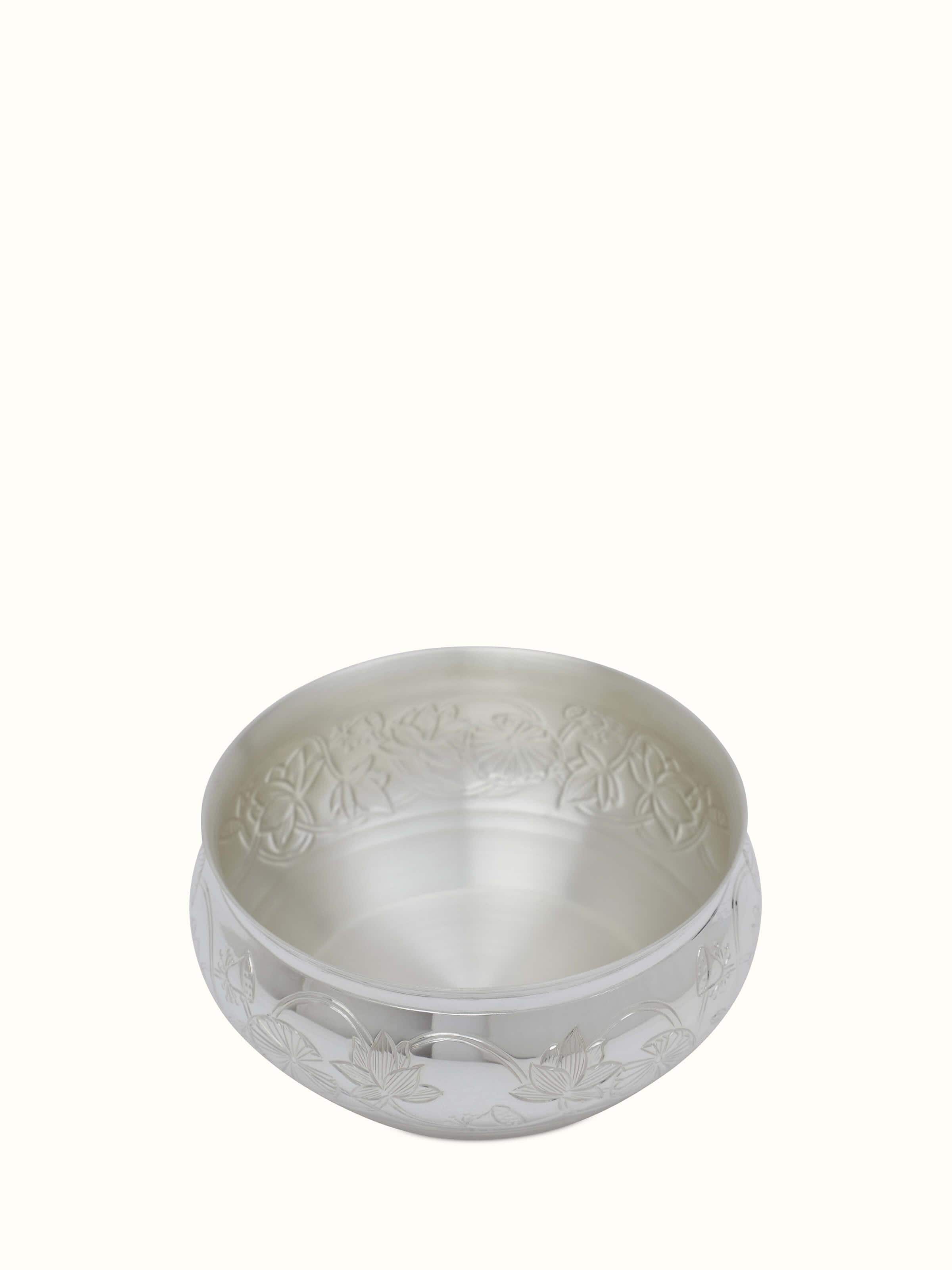 Angled view of Silver Lotus Dinner Bowl highlighting the bowl's reflective surface