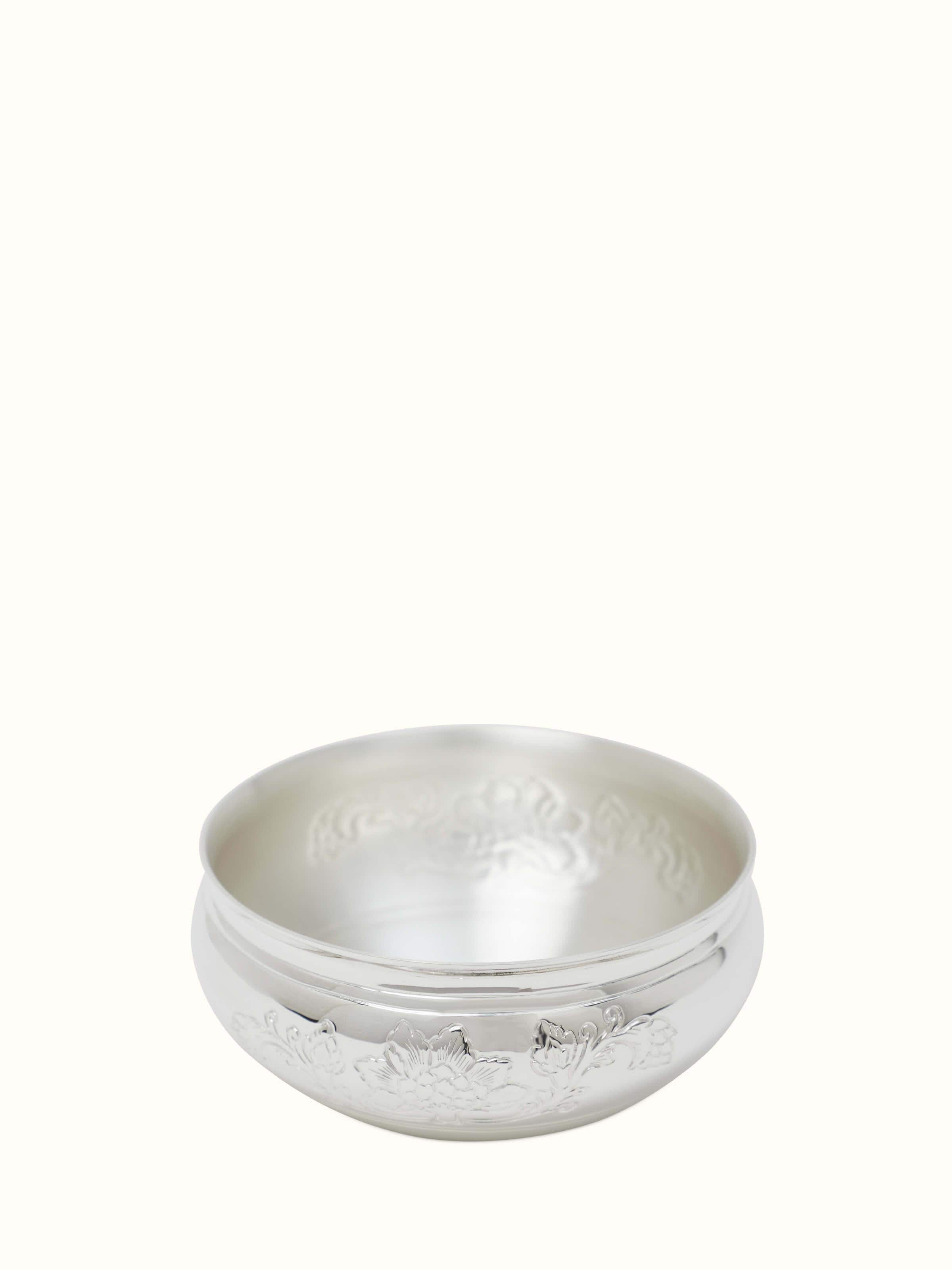 Close-up of Kalamkari silver dinner bowl with intricate patterns