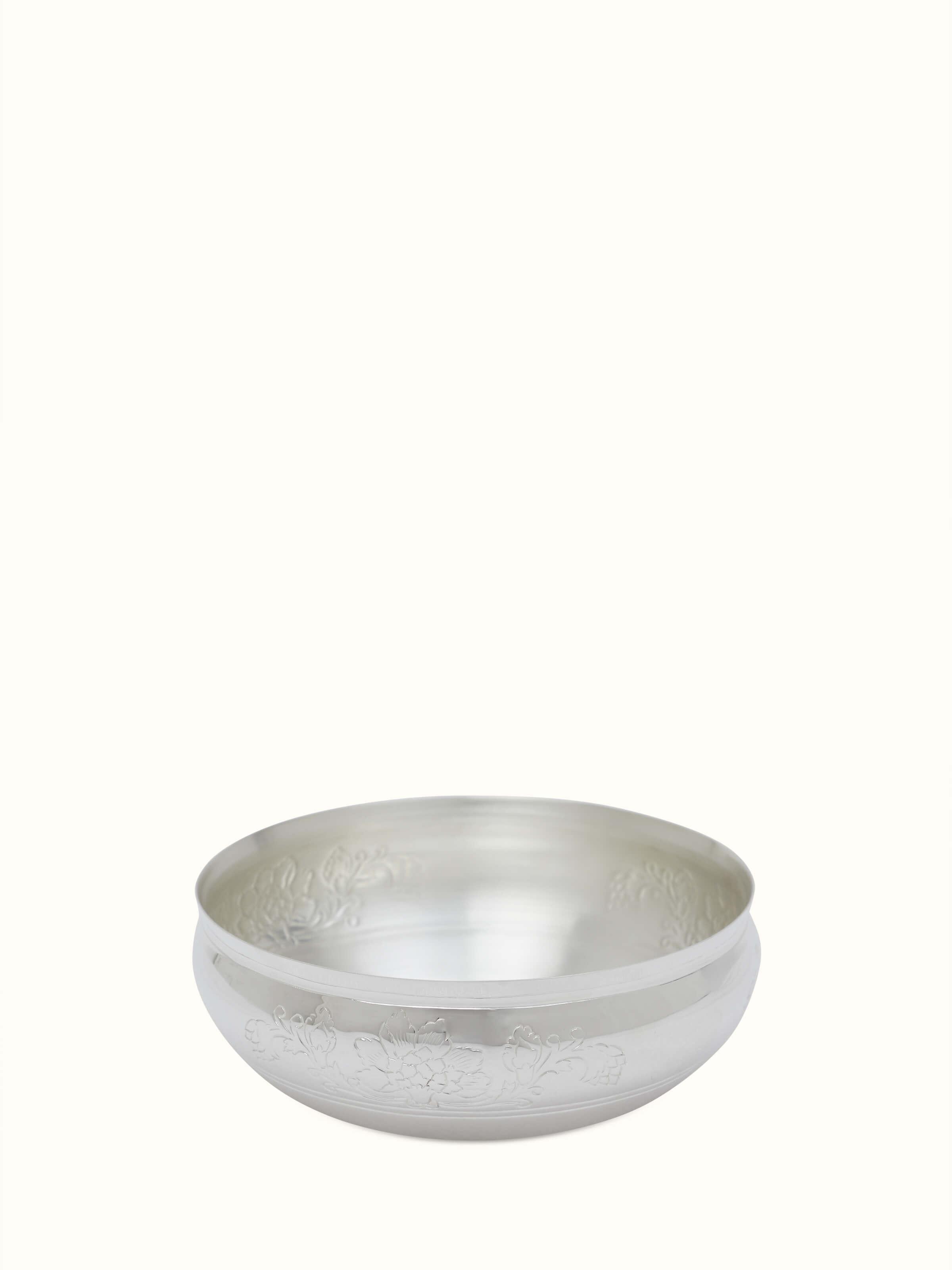 Front view of Kalamkari silver shallow bowl highlighting the intricate patterns and reflective silver surface.