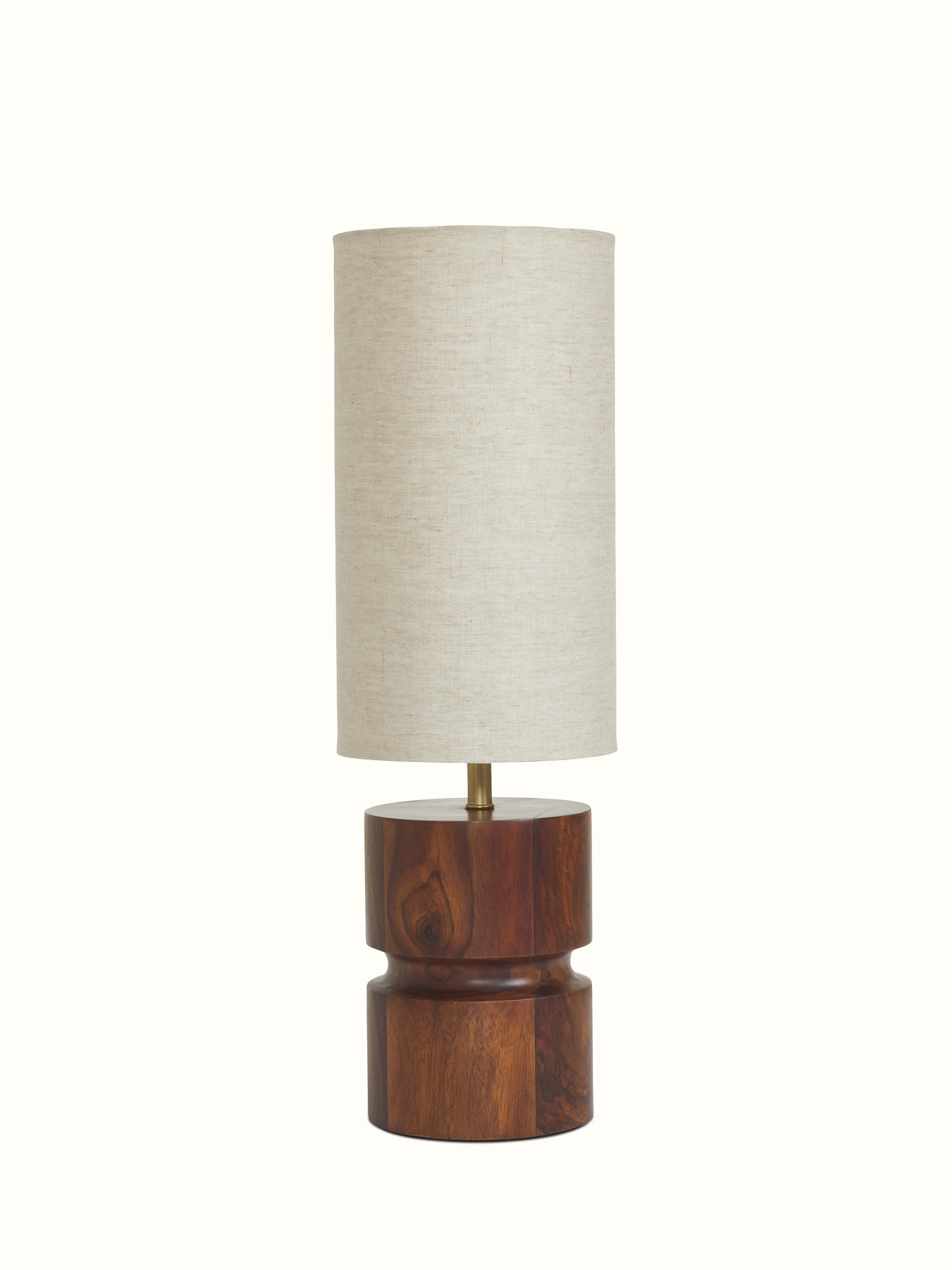 Side view of tall beige wood and cotton fabric table lamp, showcasing its height and design details.