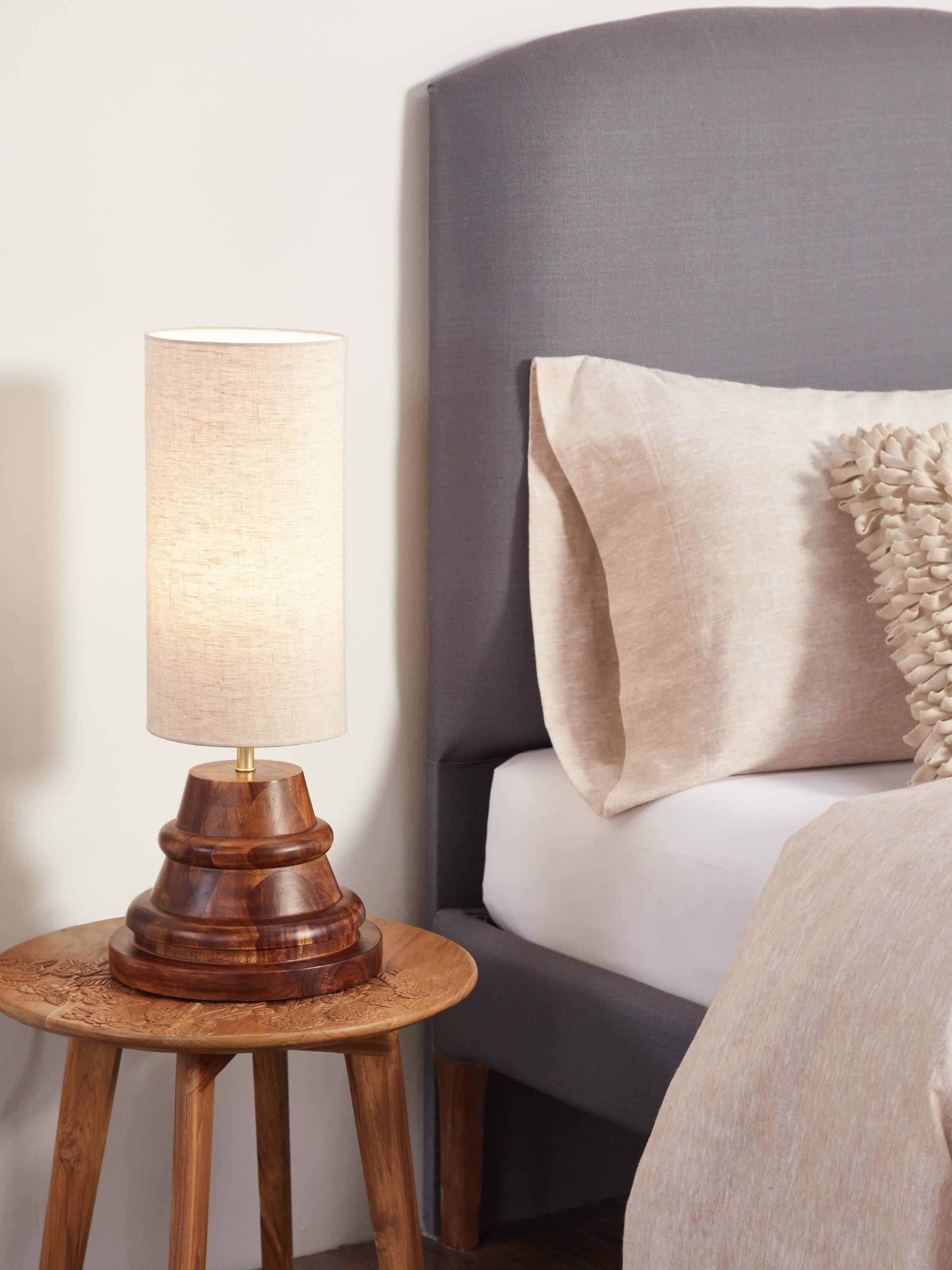 Side view of Wooden Console Lamp with Beige Cotton Fabric Shade, focusing on the lamp's structure and soft lighting