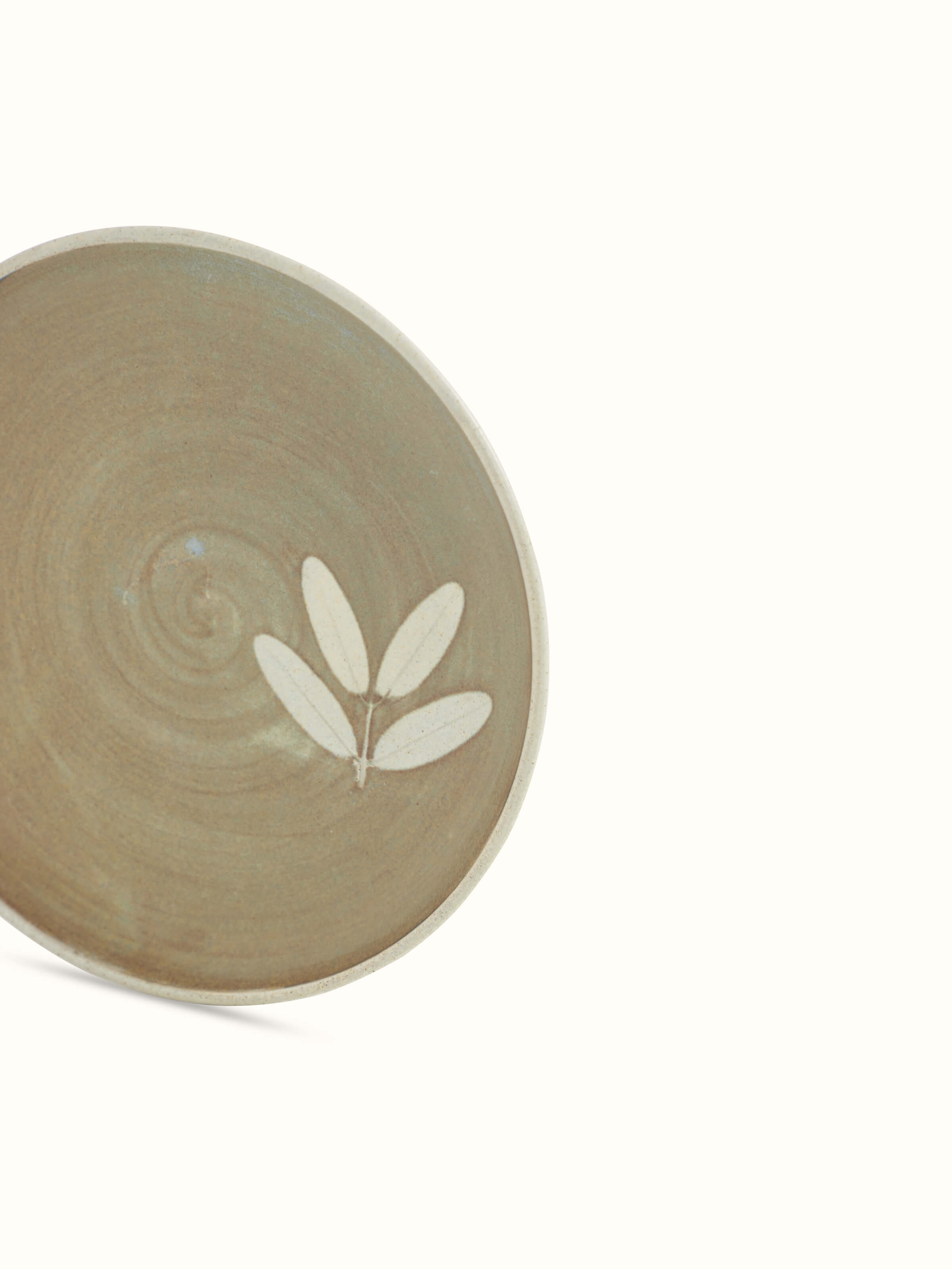 Close-up of Studio pottery ceramic dinner plate large, showcasing detailed patterns and finish.