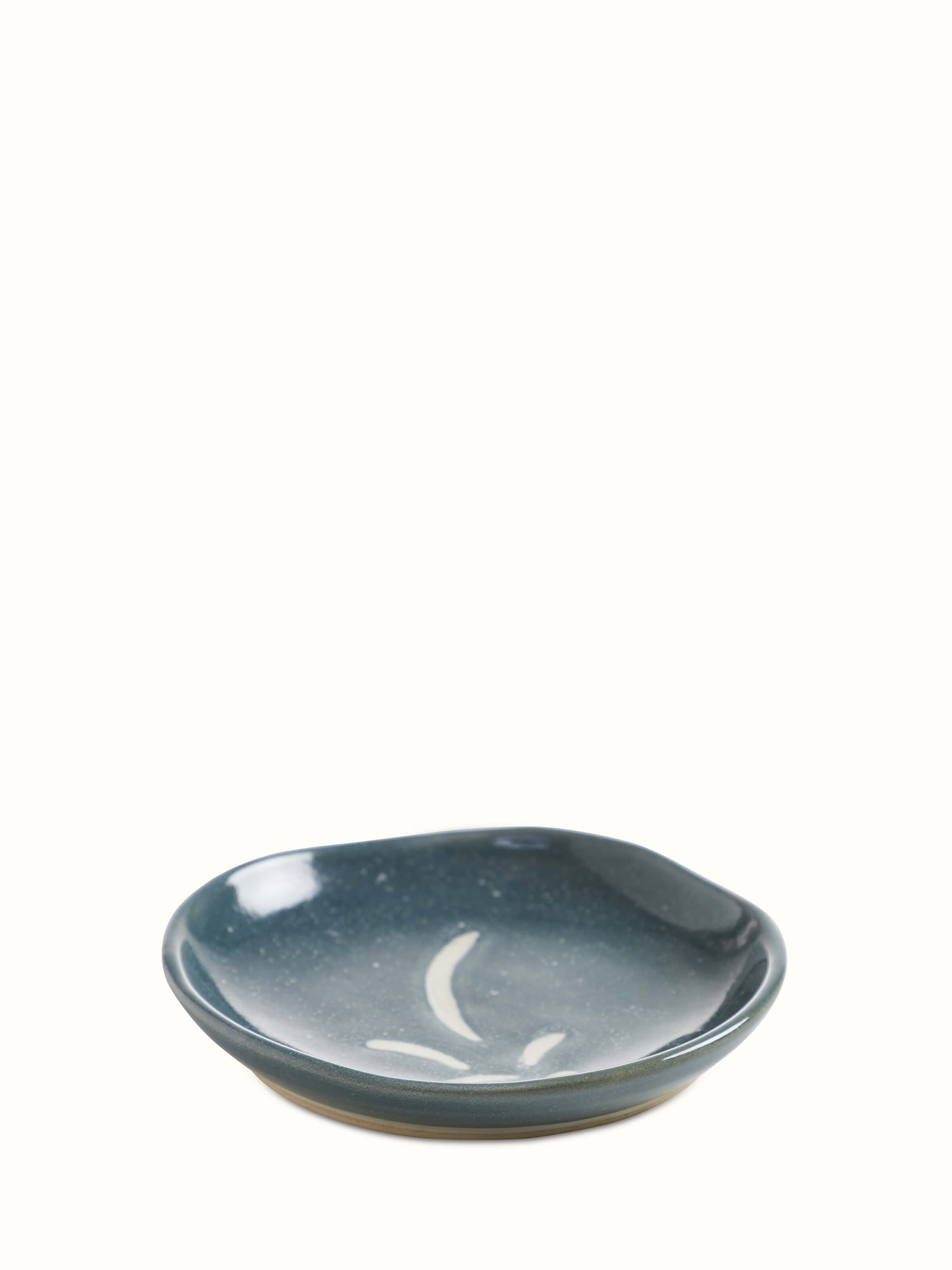 Detailed view of a grey studio pottery ceramic salad plate, showcasing its elegant design and finish.