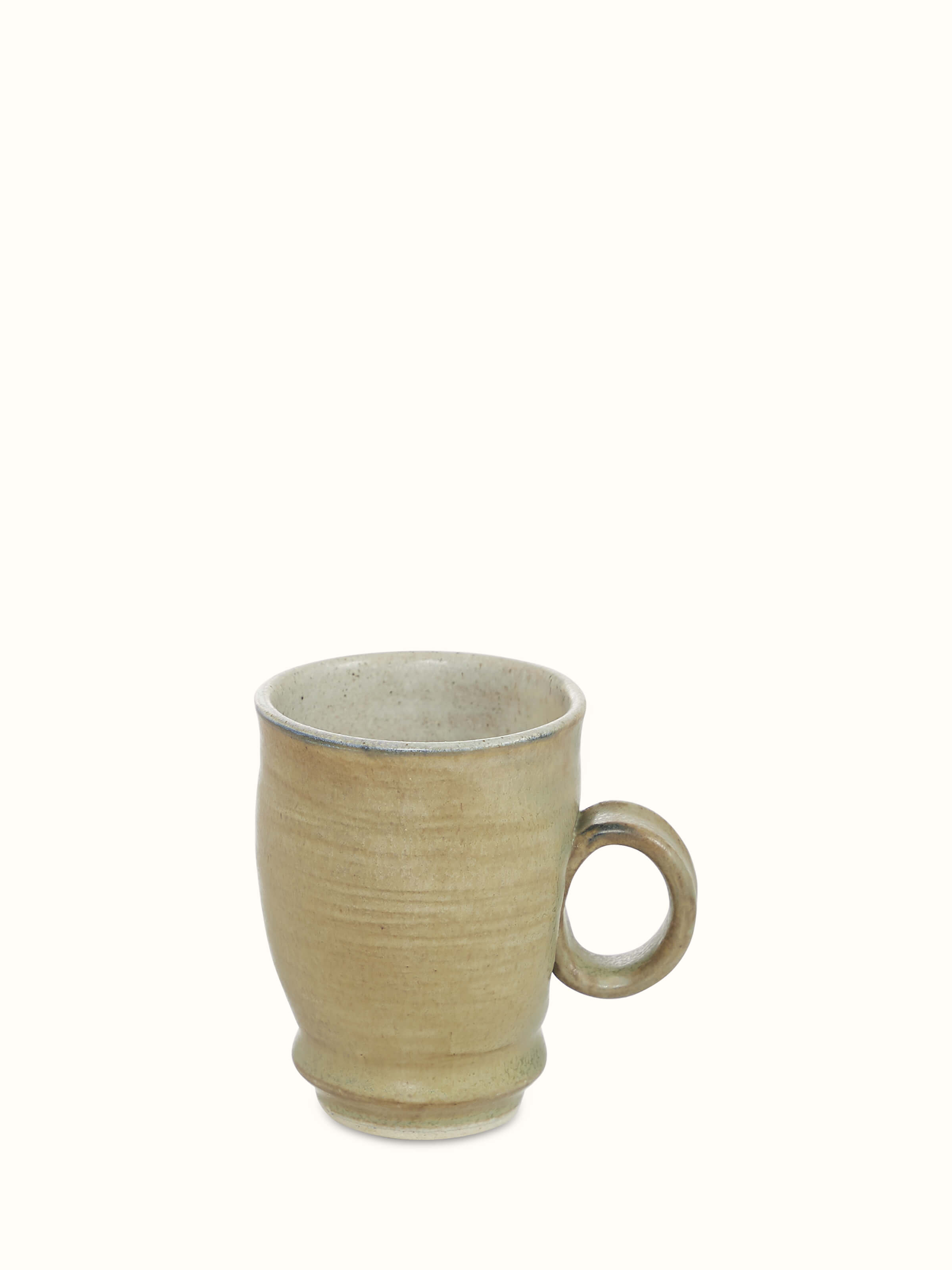 Close-up of Studio pottery ceramic coffee mug in olive color emphasizing its detailed texture