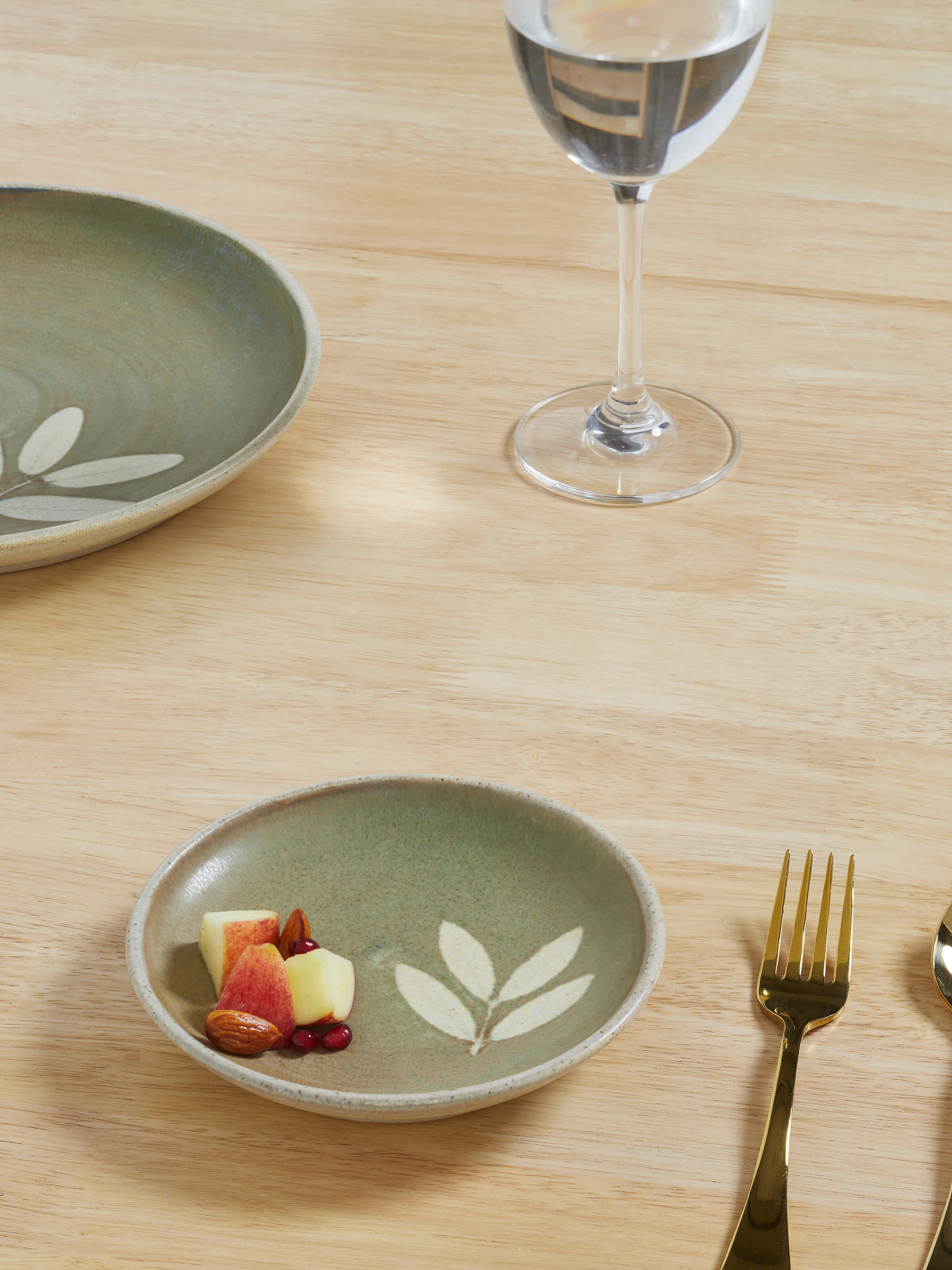 Side view of Studio pottery ceramic salad plate in brown