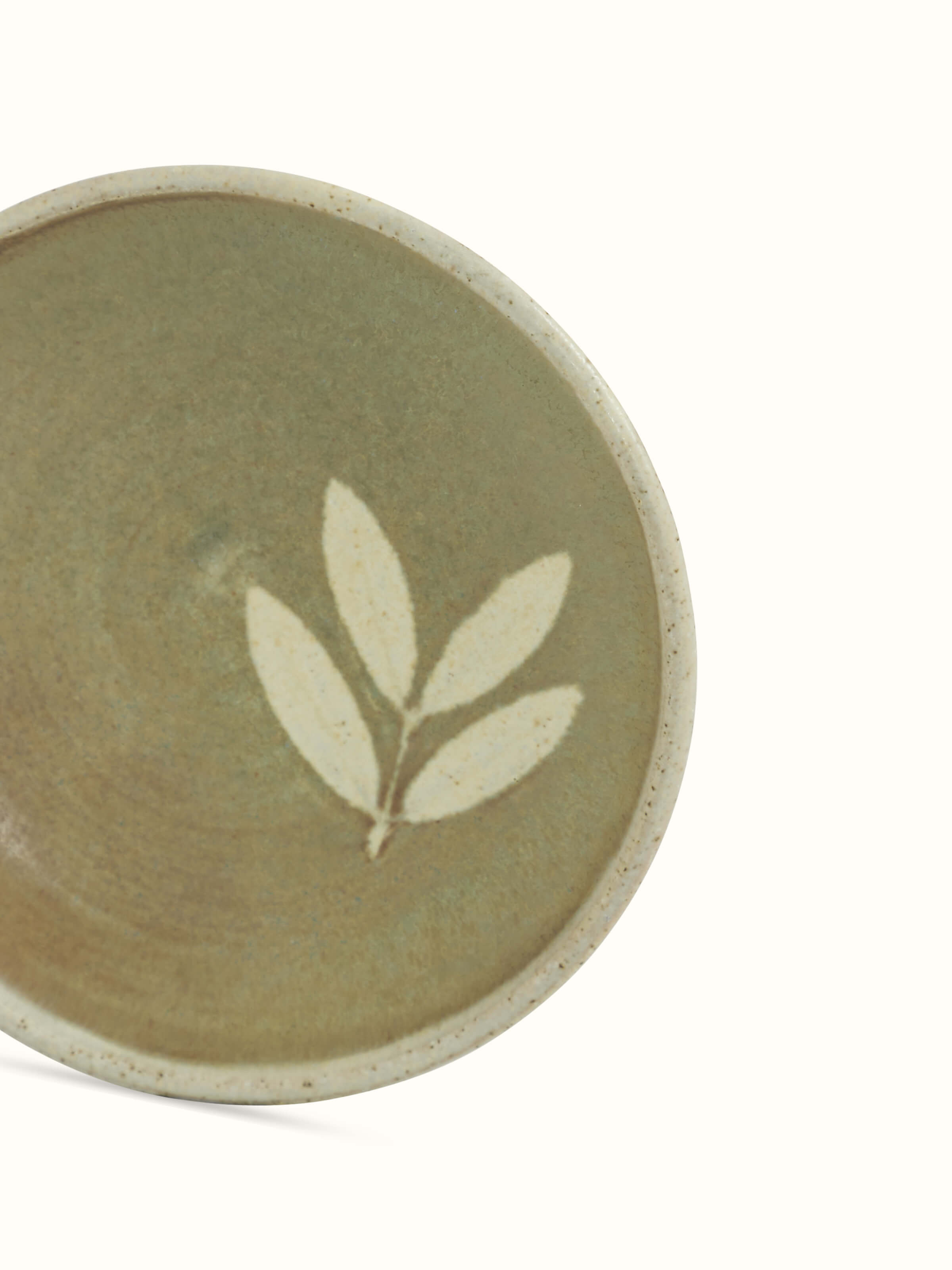 Detailed view of Studio pottery ceramic salad plate in brown