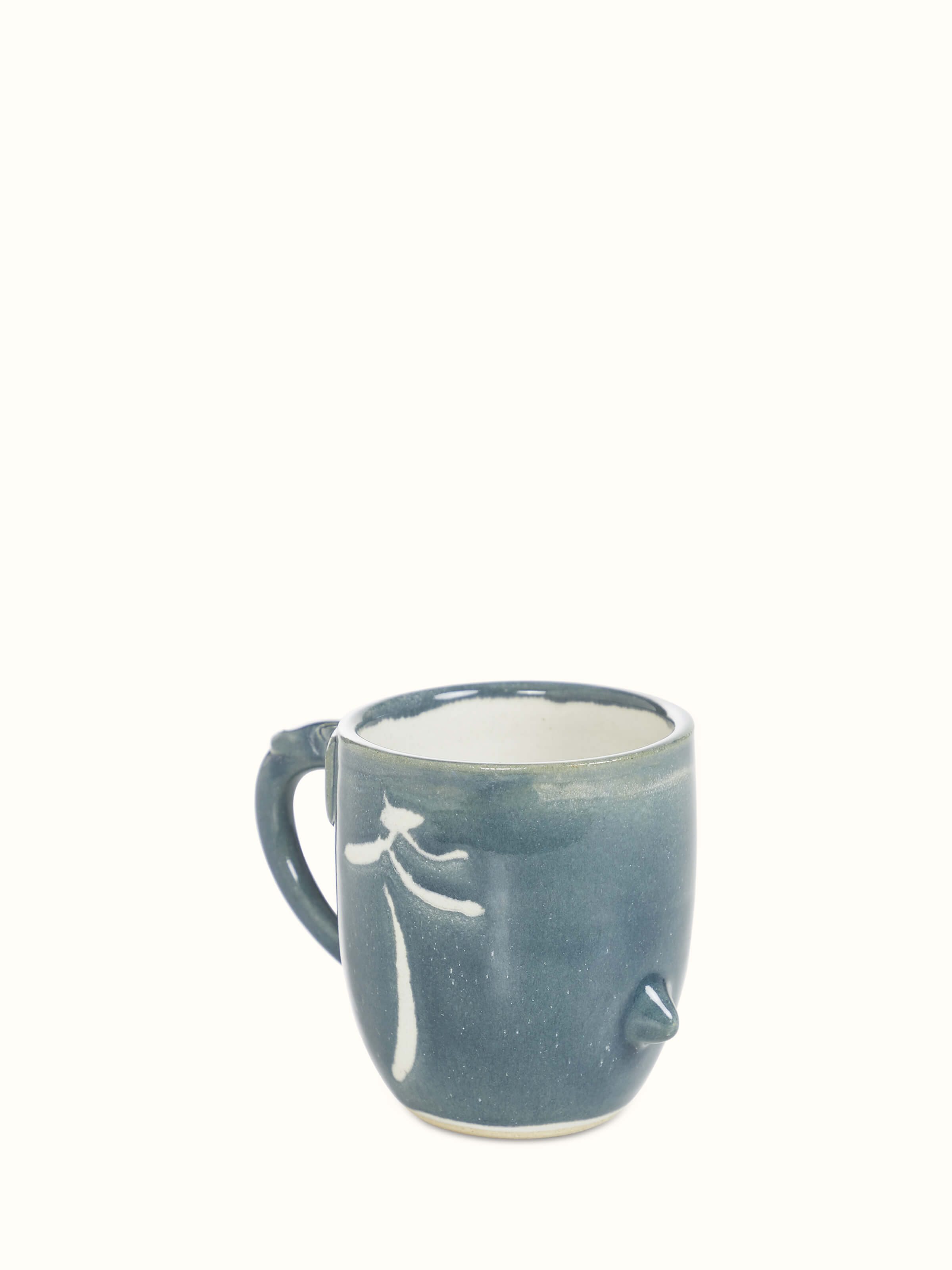 Full view of the studio pottery ceramic coffee mug in blue, displaying its shape and design.