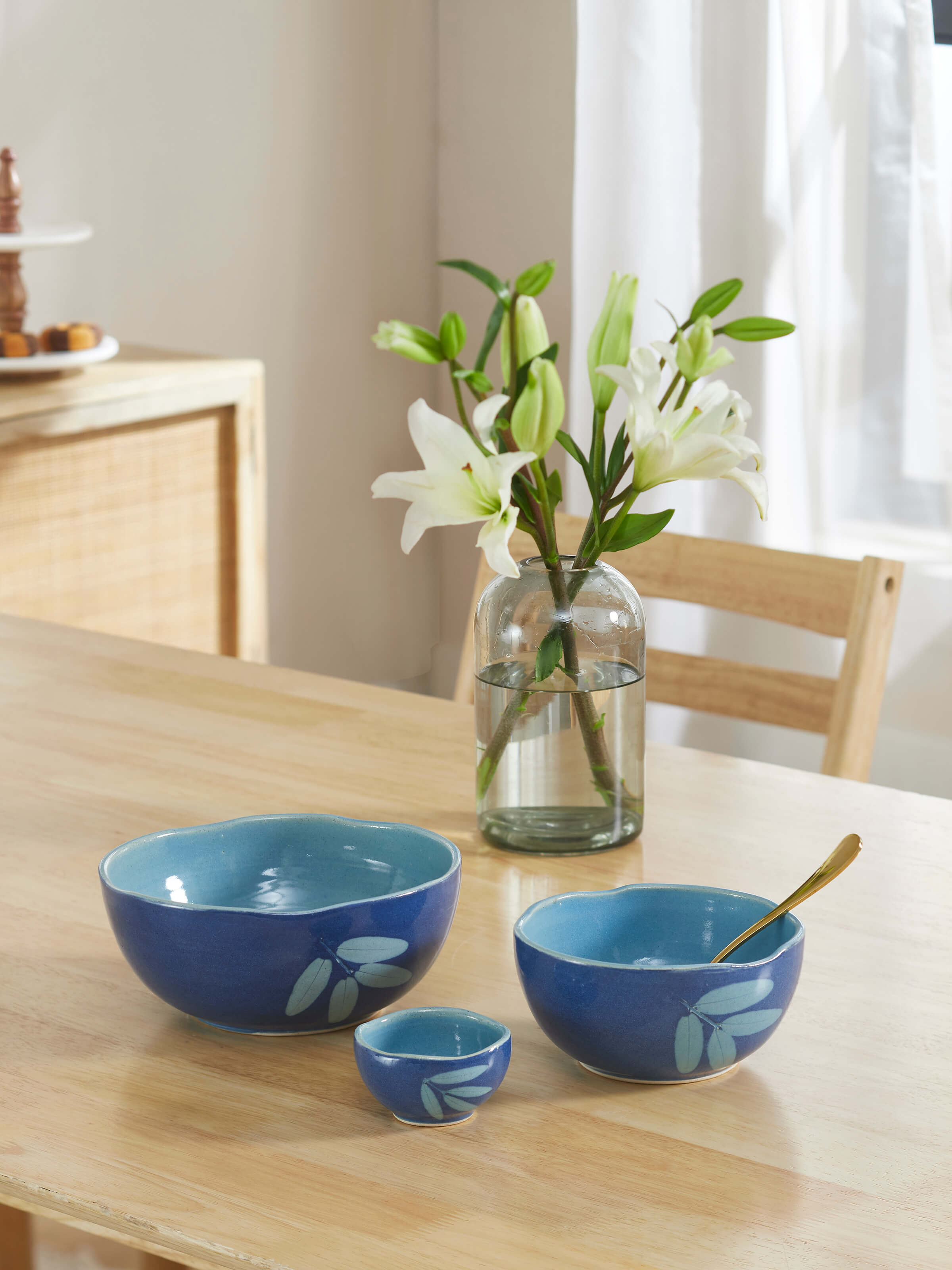 Side view of Studio pottery ceramic serving bowls in blue (3 pcs) emphasizing their refined shape