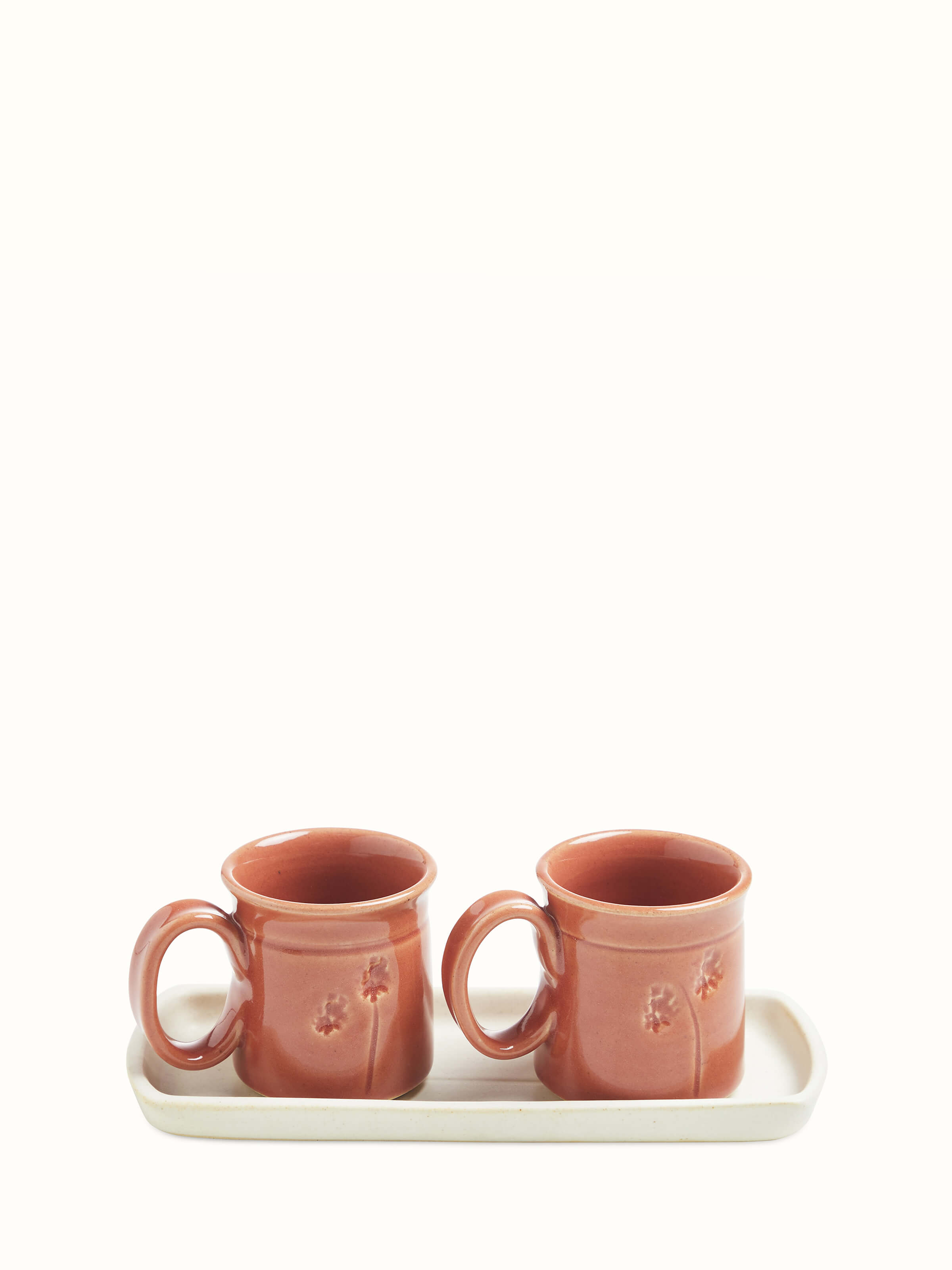 Front view of Studio pottery ceramic coffee mugs in various colors, set of 2, highlighting the unique patterns