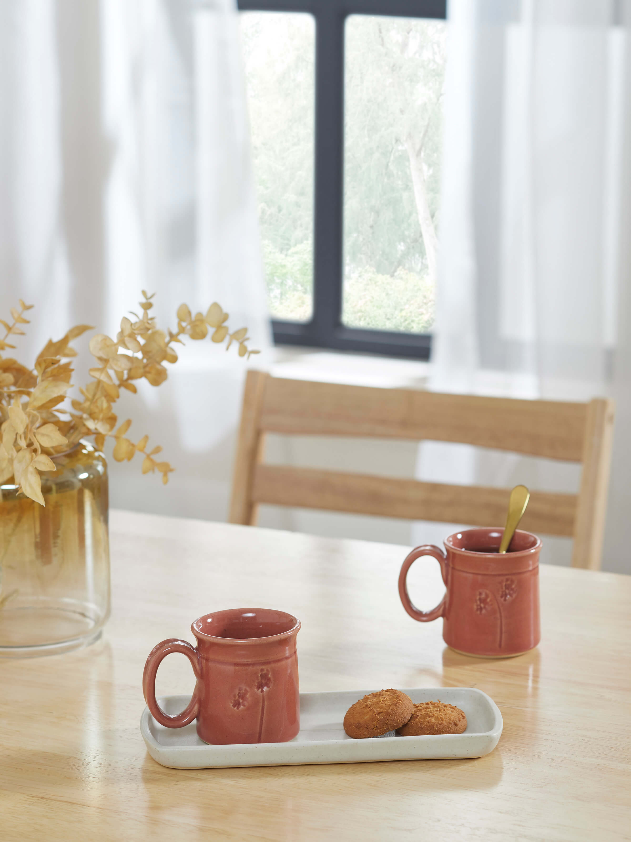 Side view of Studio pottery ceramic coffee mugs in various colors, set of 2, emphasizing the handcrafted design
