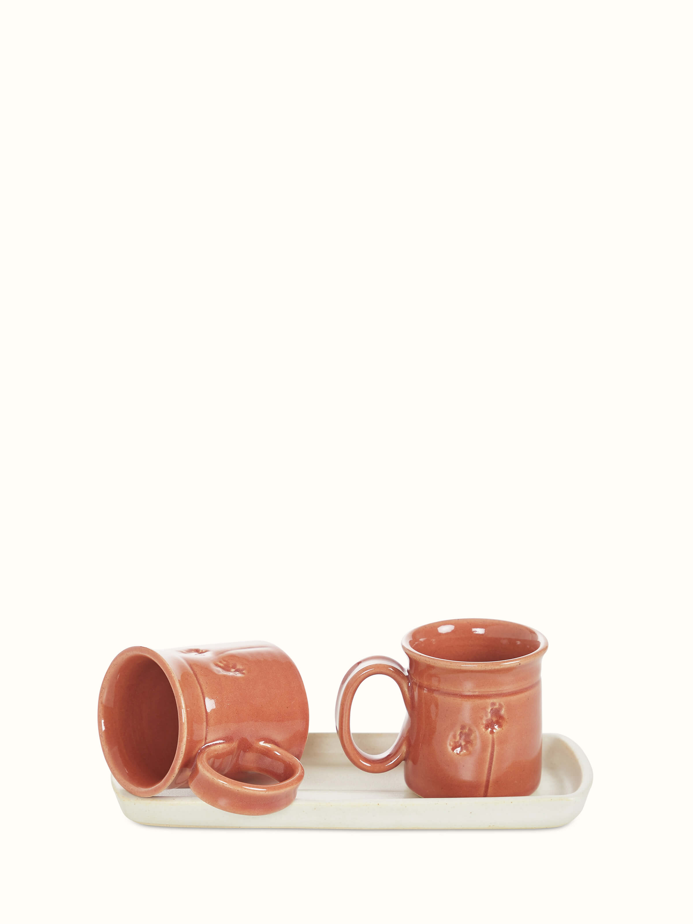 Detailed view of Studio pottery ceramic coffee mugs in various colors, set of 2, showing the artistry