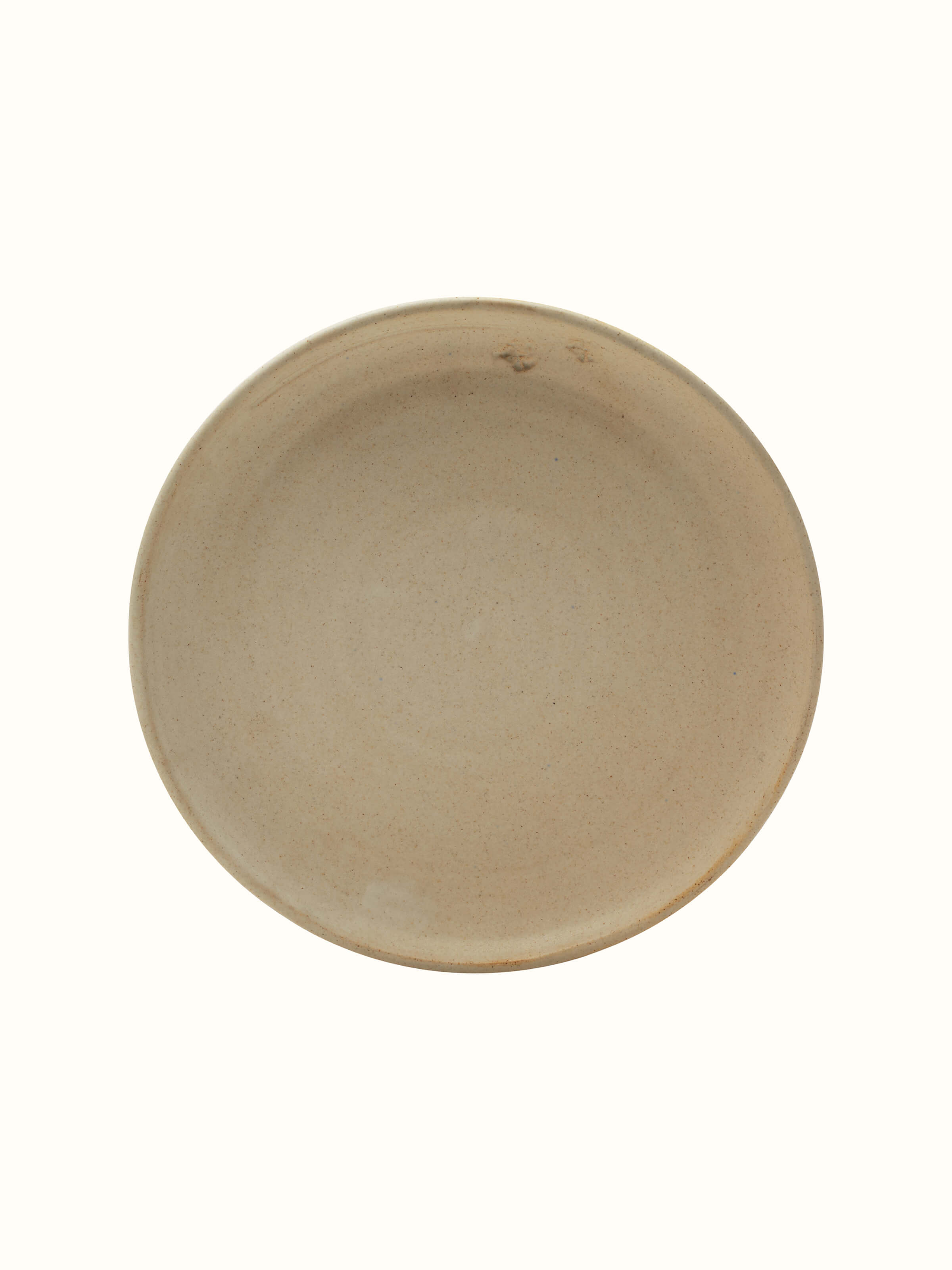 Close-up detail of Studio Pottery Ceramic Dinner Plate Beige highlighting the texture and glaze.