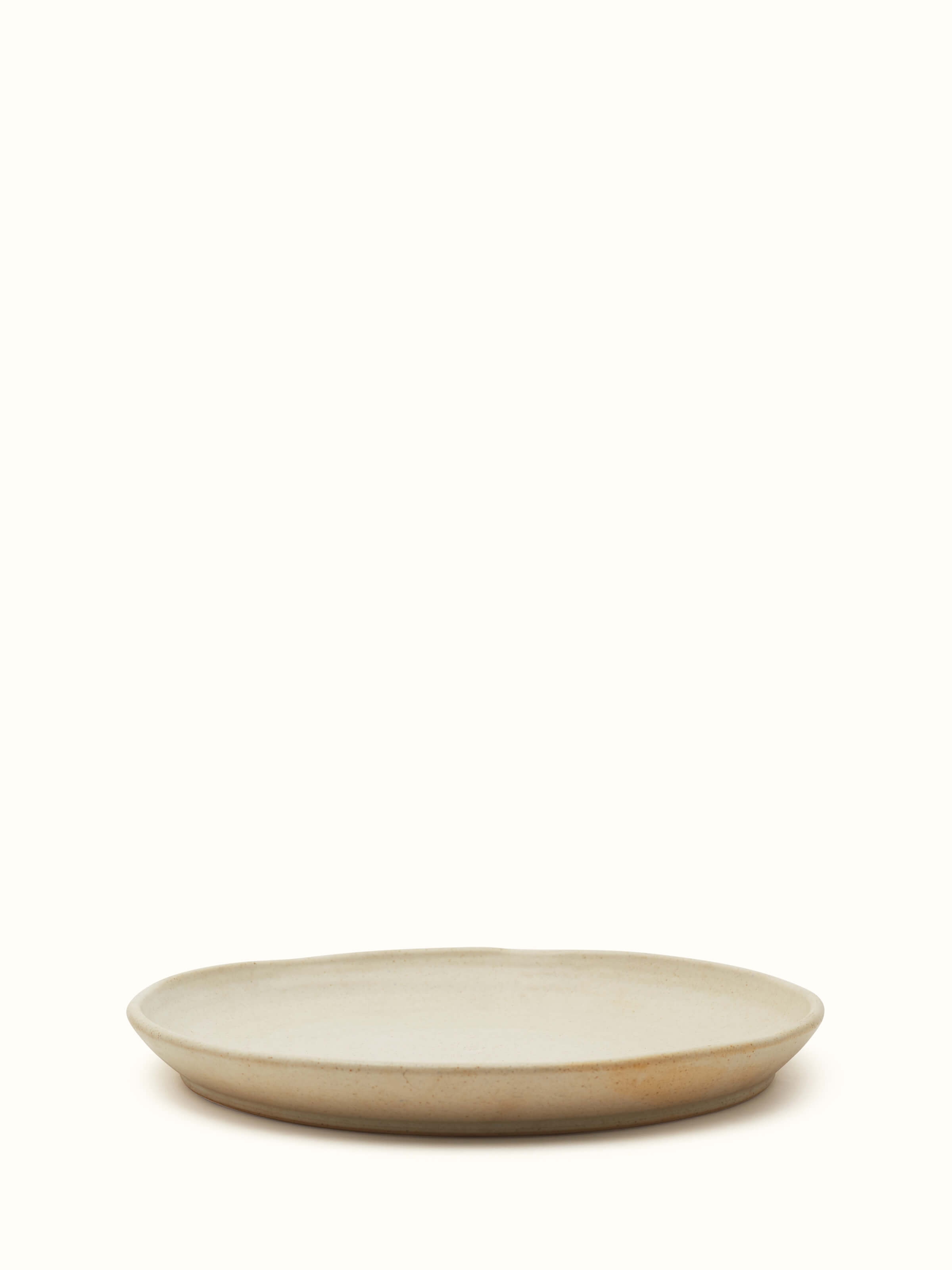 Front view of Studio Pottery Ceramic Dinner Plate Beige displaying the elegant design and beige color.