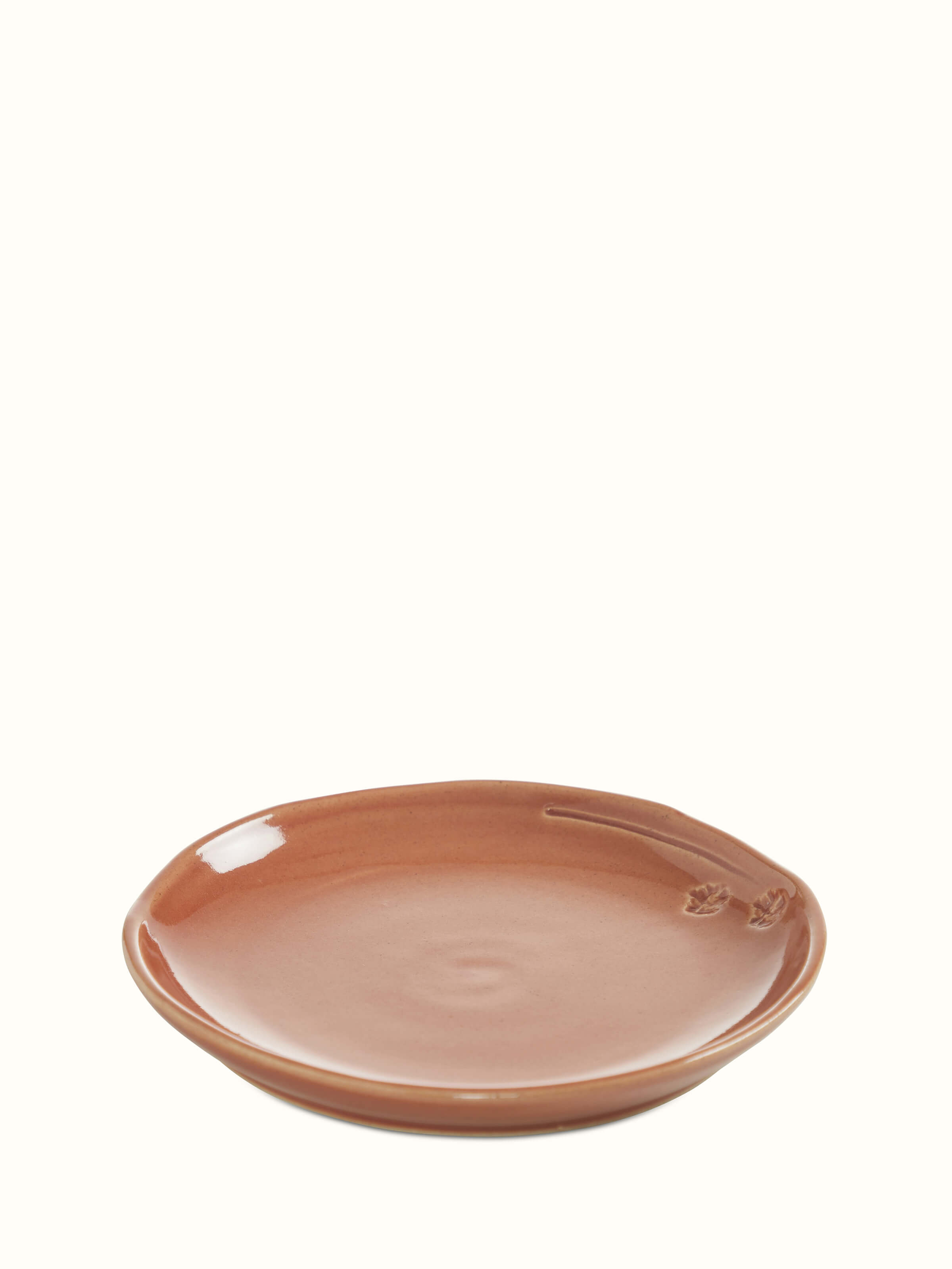 Front view of studio pottery ceramic dessert plate in beige, showcasing its smooth glaze and elegant design