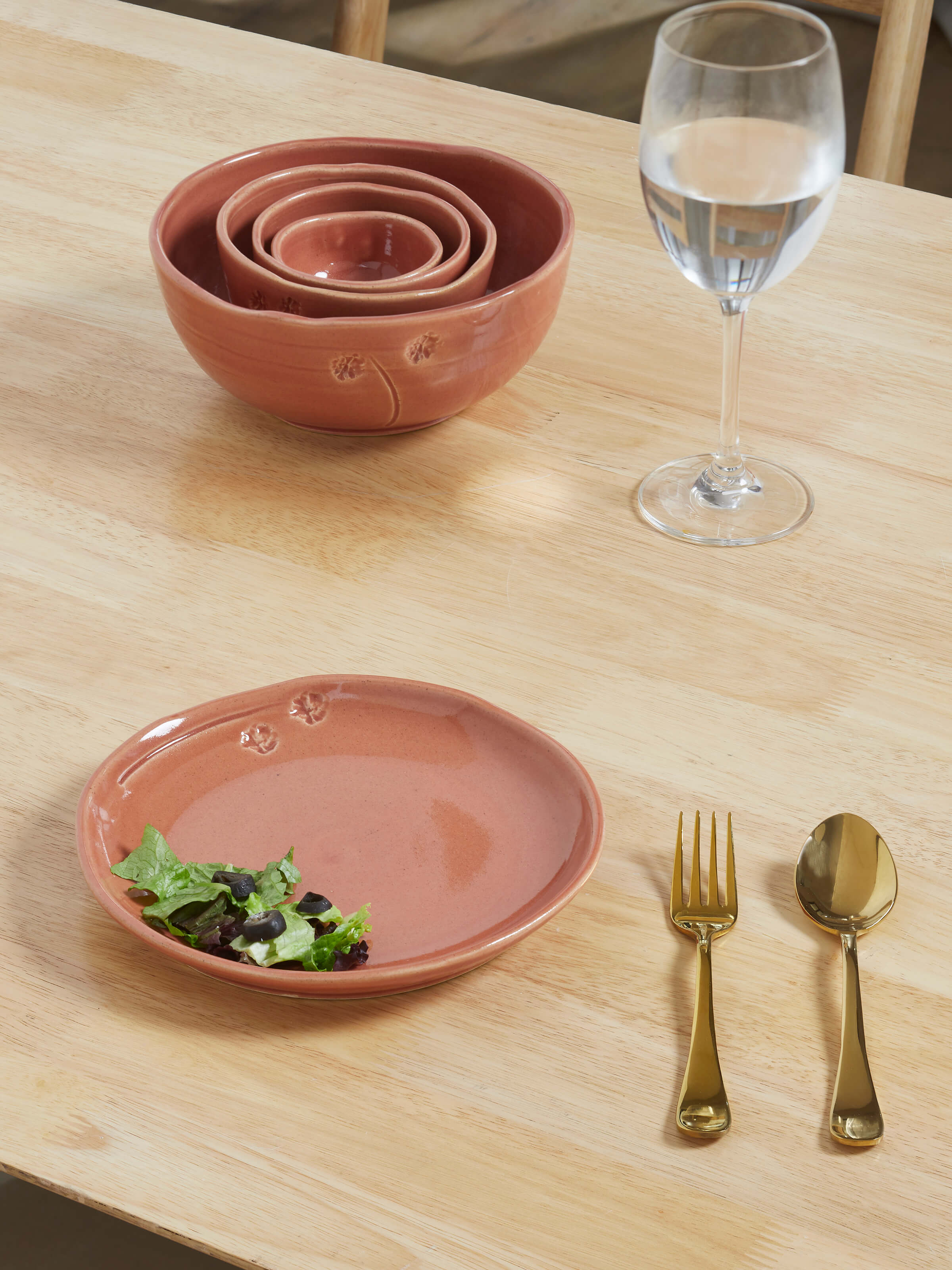 Side view of studio pottery ceramic dessert plate in beige, highlighting the subtle curves and refined craftsmanship