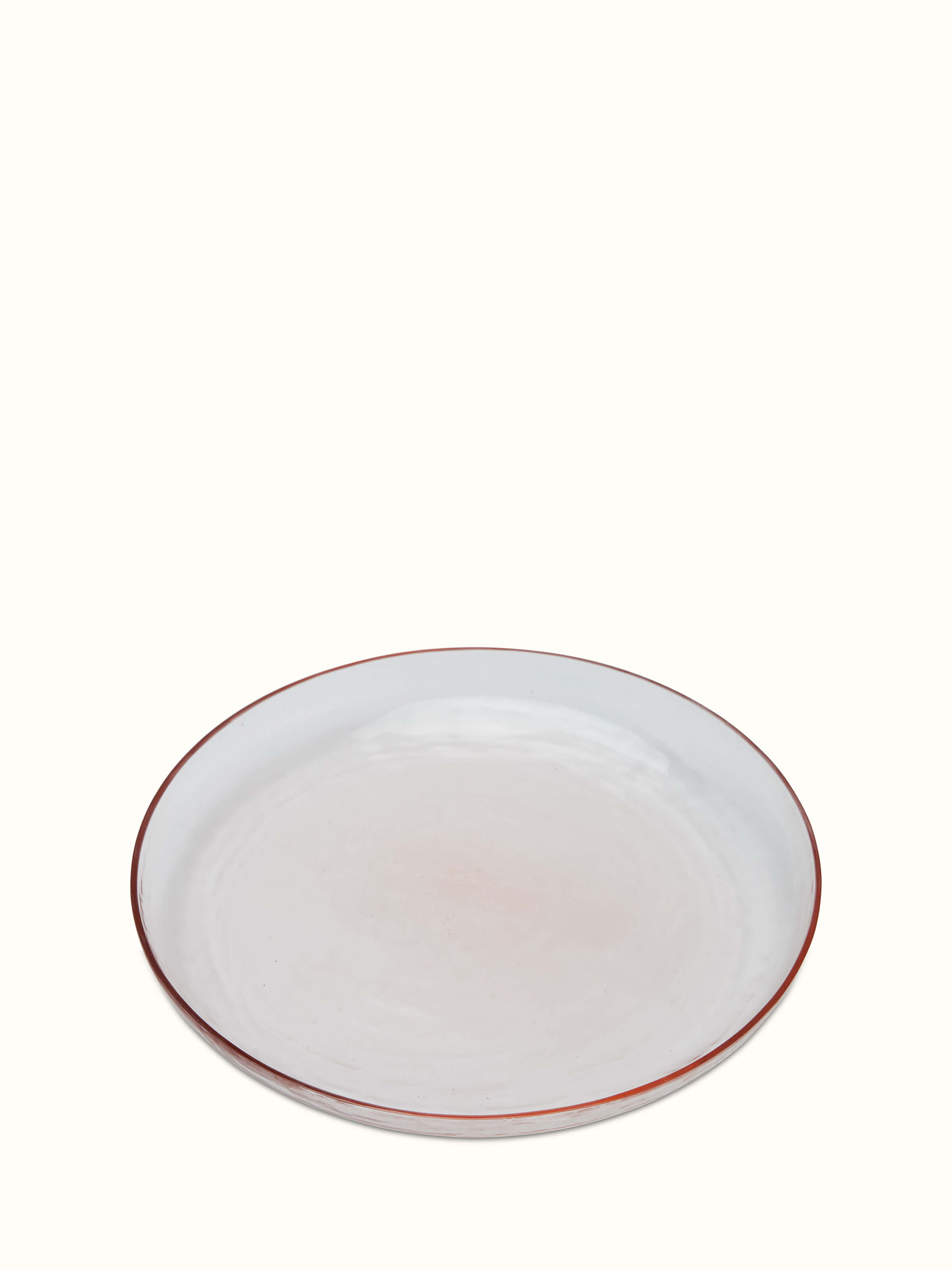 Close-up of pink Firozabadi glass dinner plate, showcasing its intricate patterns and quality.