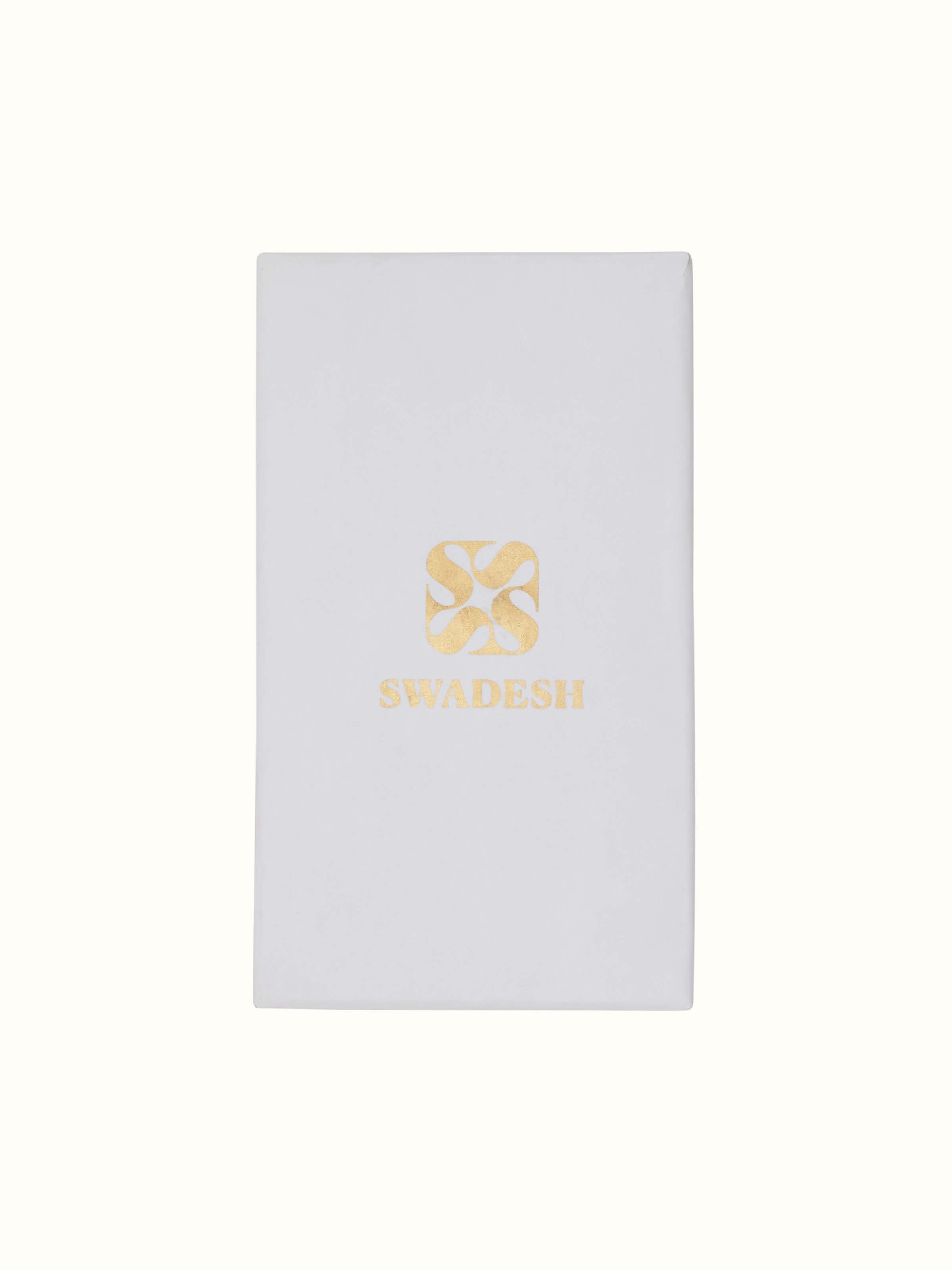 Top view of Nakkashi brass cutlery set showcasing artistic detailing