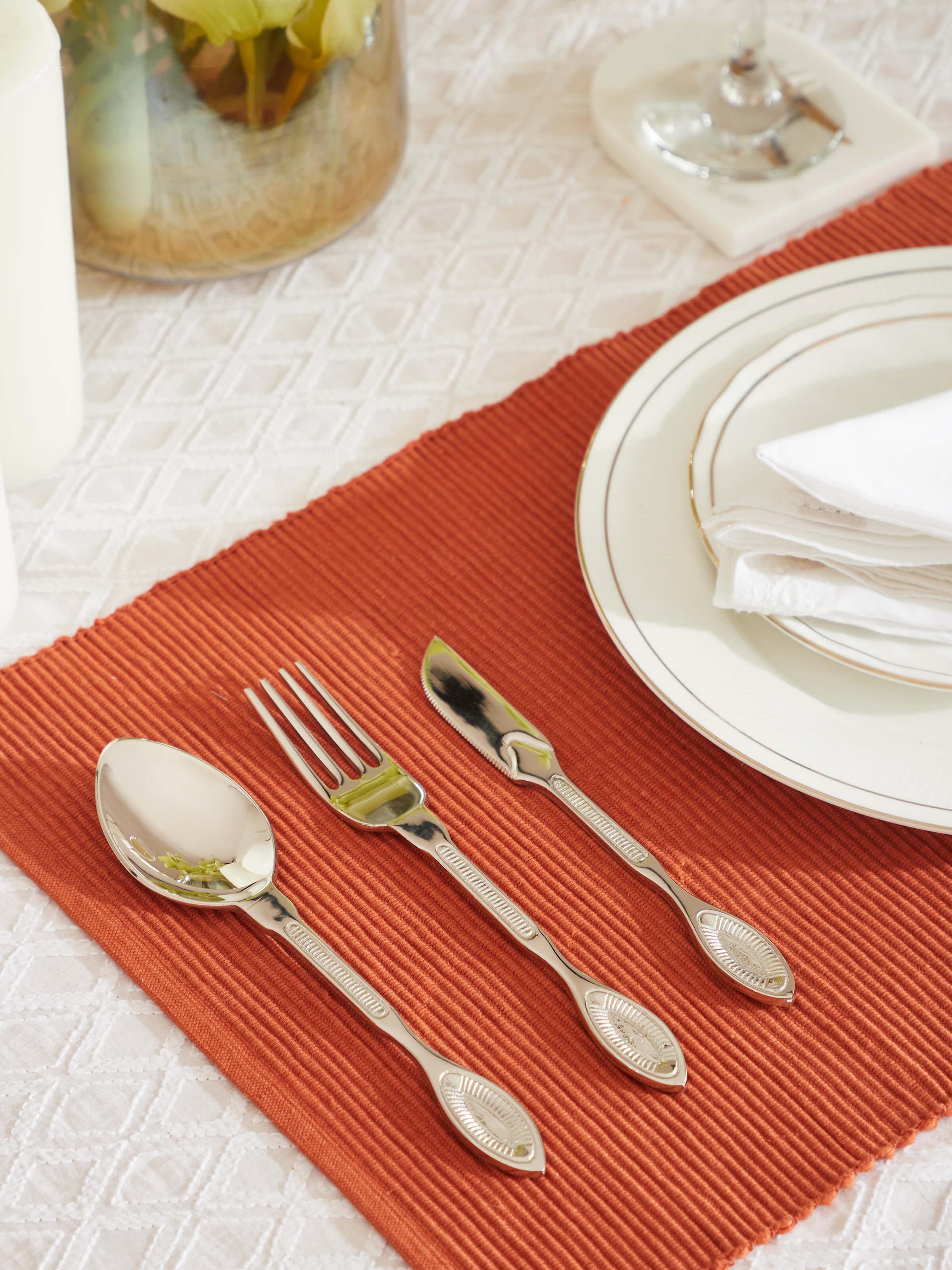 Side view of Brass cutlery set (3 pcs) showcasing the sleek lines and shiny surface of the cutlery.