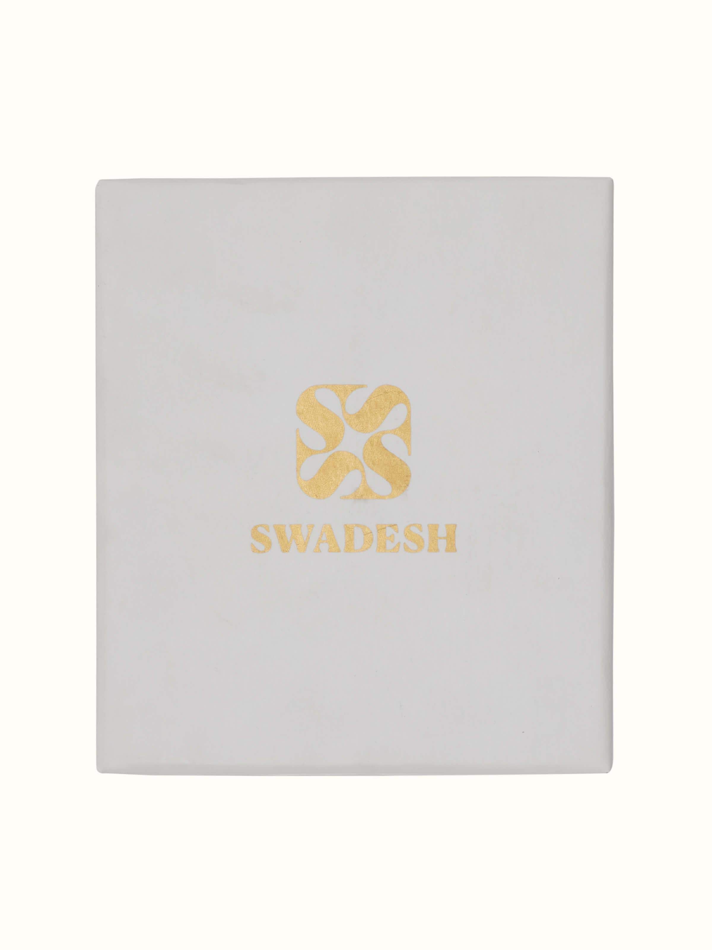 Angled view of Brass Teaspoons (4 pcs), demonstrating the sleek design and reflective quality of the spoons