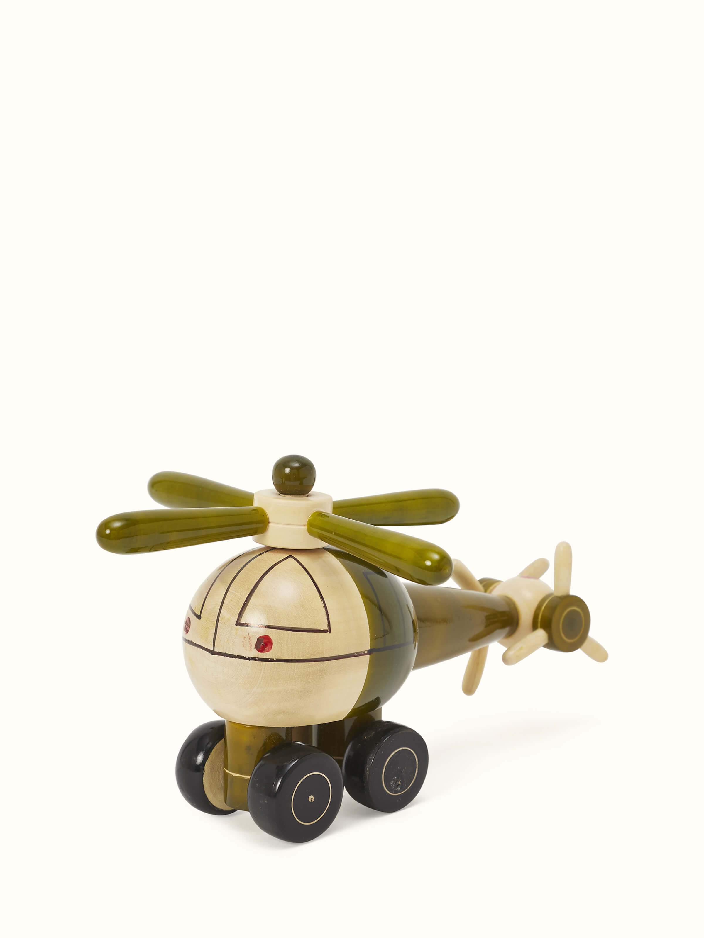 Side view of Channapatna ivory wood helicopter toy in green, highlighting the smooth finish.