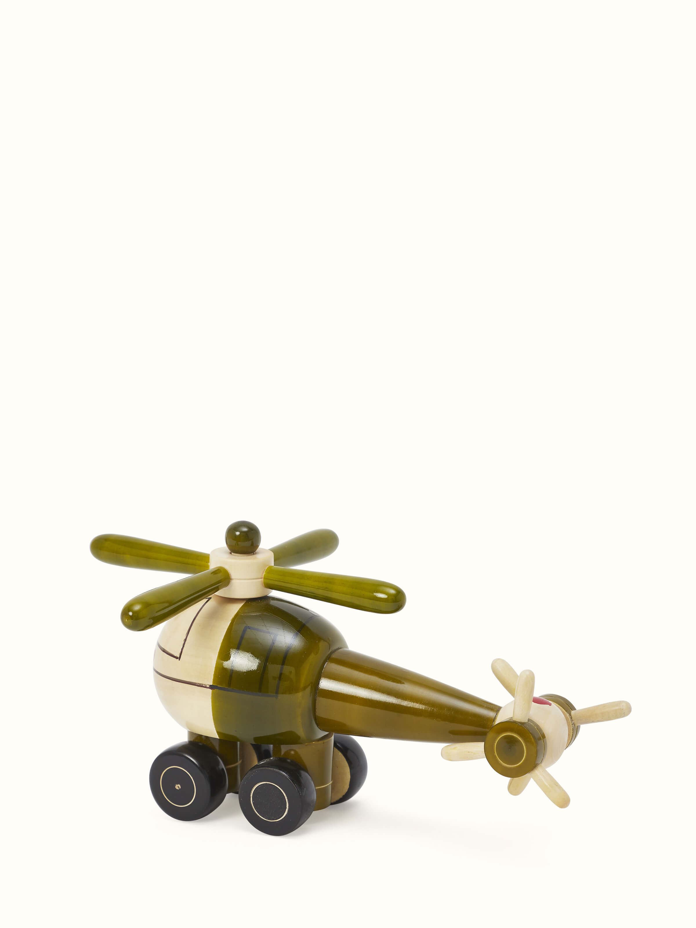 Close-up view of Channapatna ivory wood helicopter toy in green, emphasizing the fine craftsmanship.