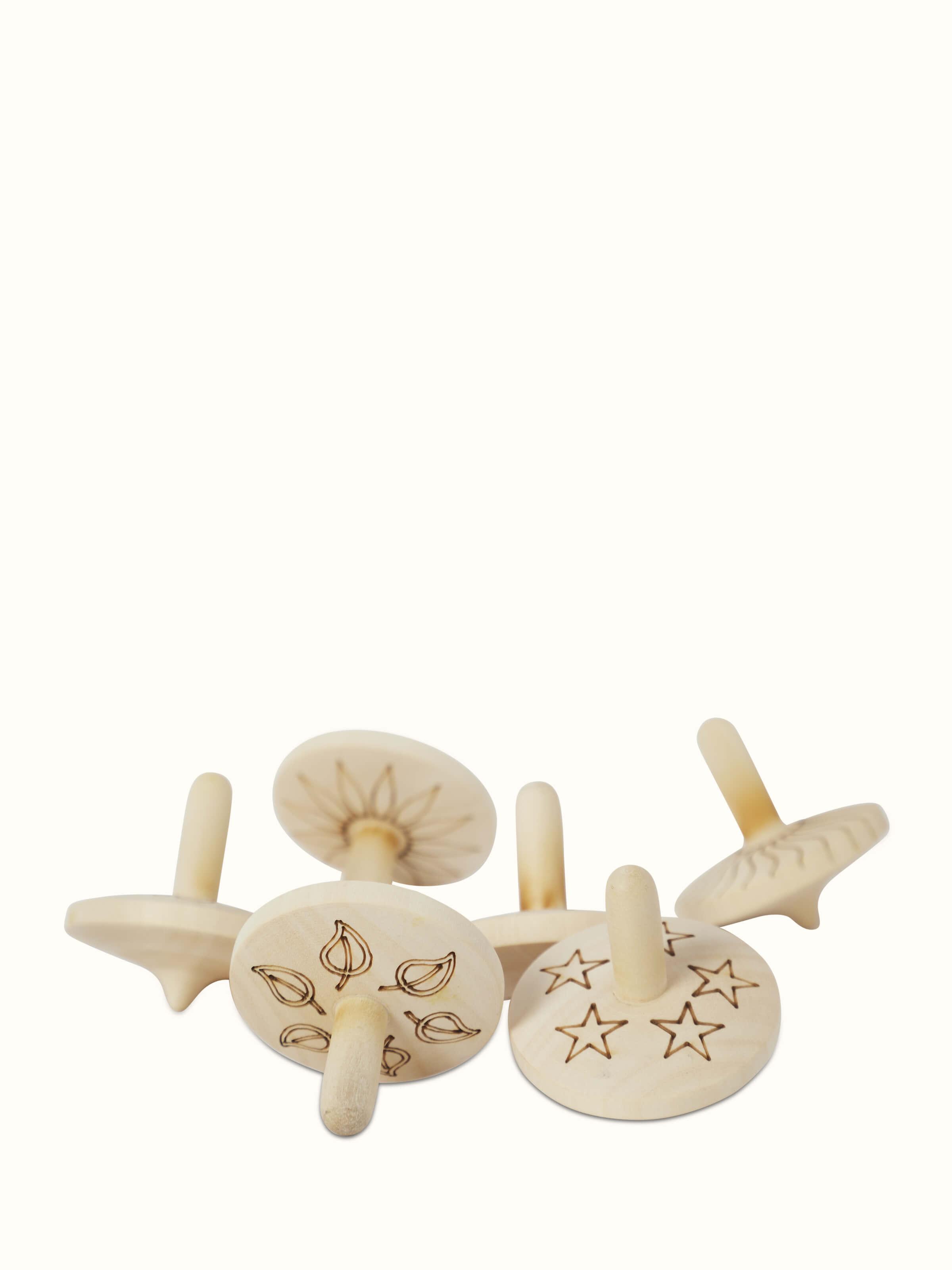 Front view of Channapatna Ivory Wood Spinning Top Toys in Off-White showcasing traditional craftsmanship.