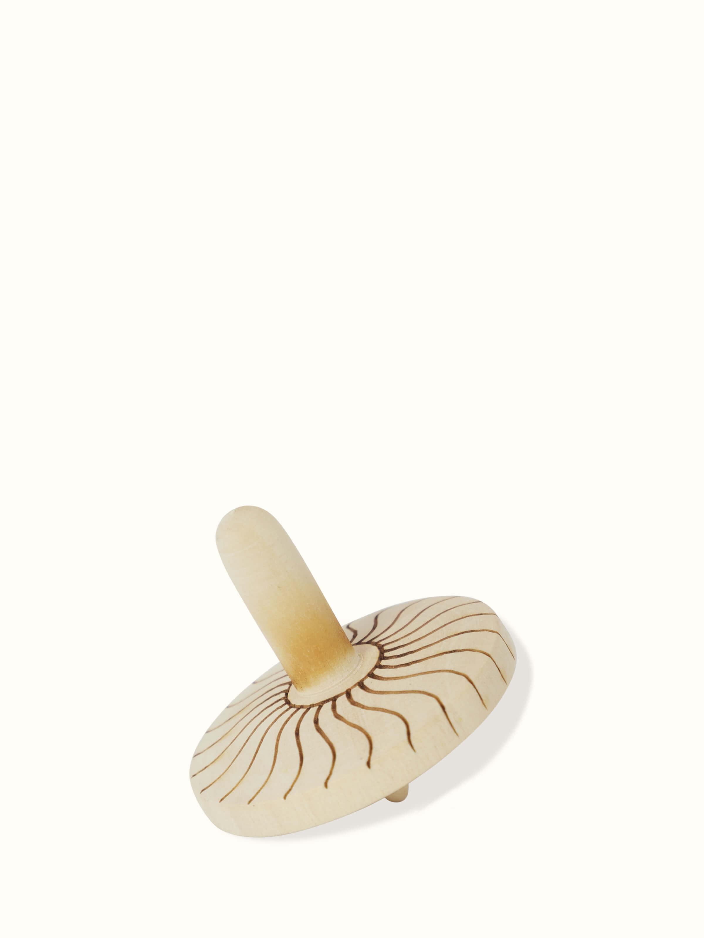 Detailed view of Channapatna Ivory Wood Spinning Top Toys in Off-White emphasizing fine woodwork.