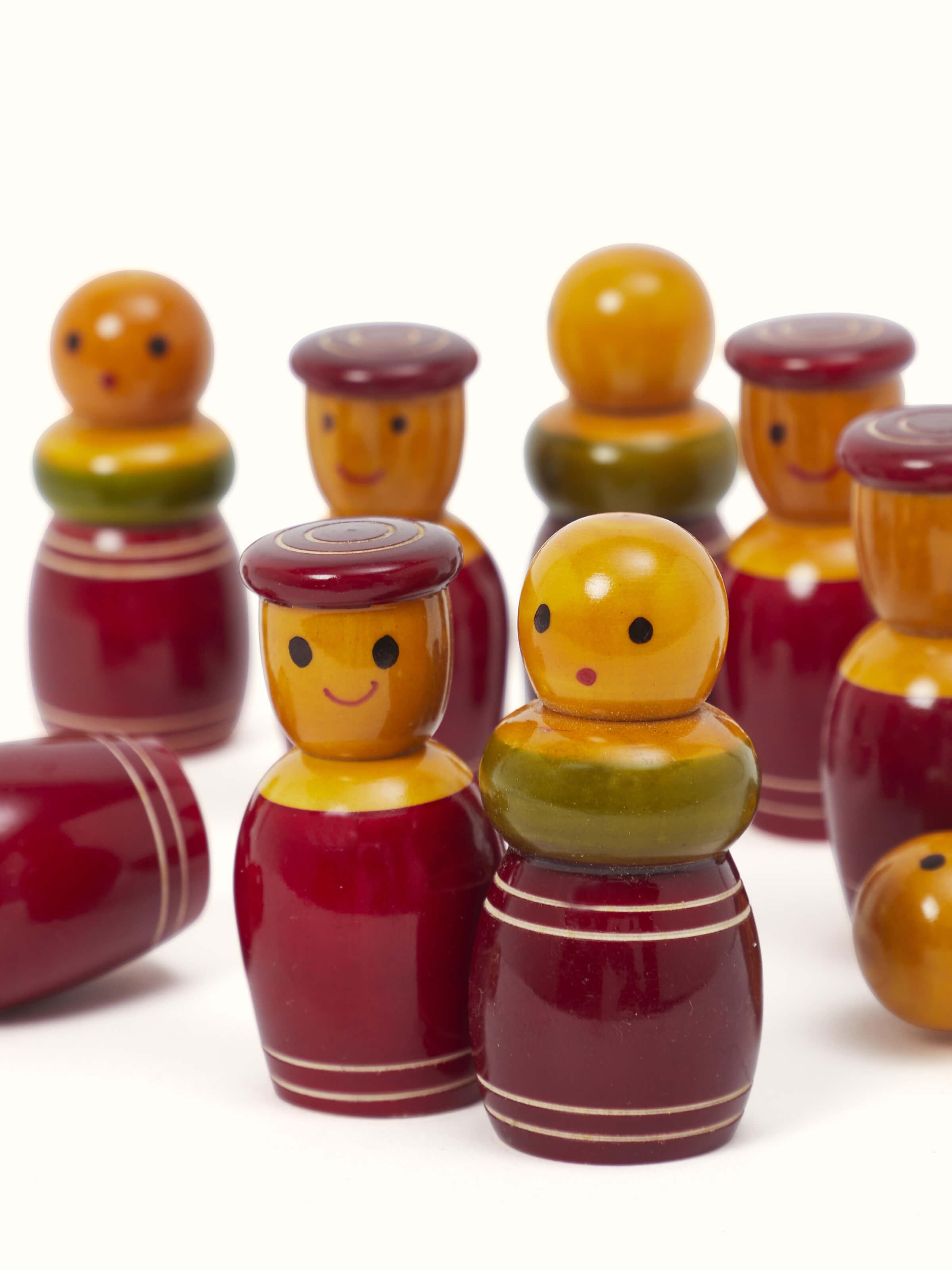 Close-up of Channapatna ivory wood tic-tac game in green showcasing smooth wooden texture.