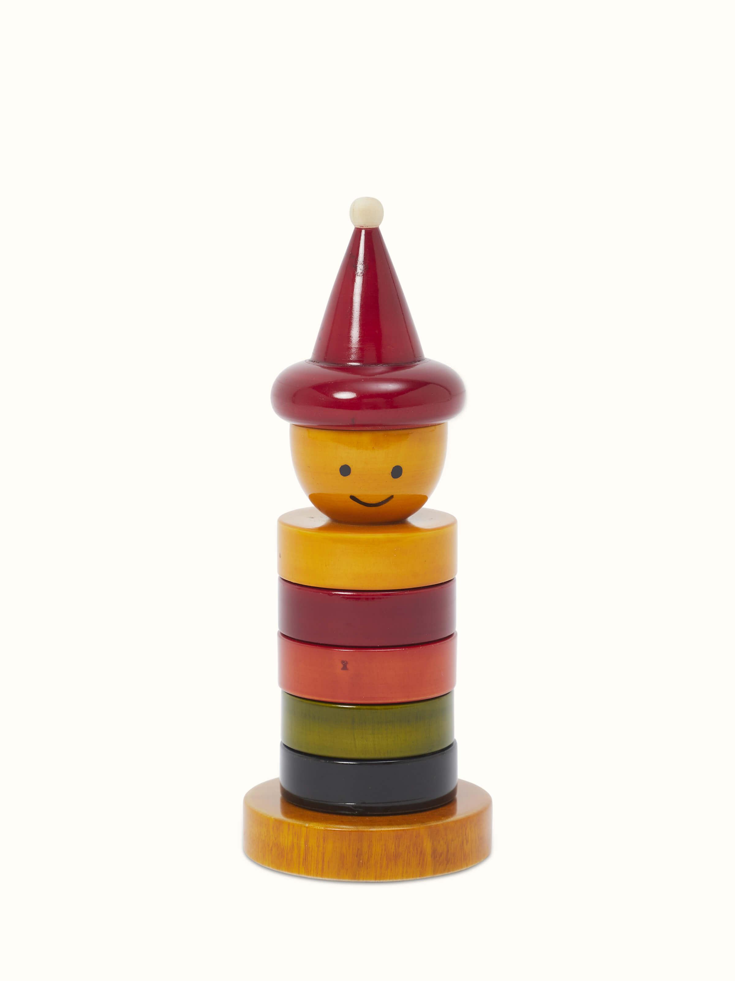 Side view of Channapatna ivory wood stack-a-joker, showcasing its unique design and craftsmanship.