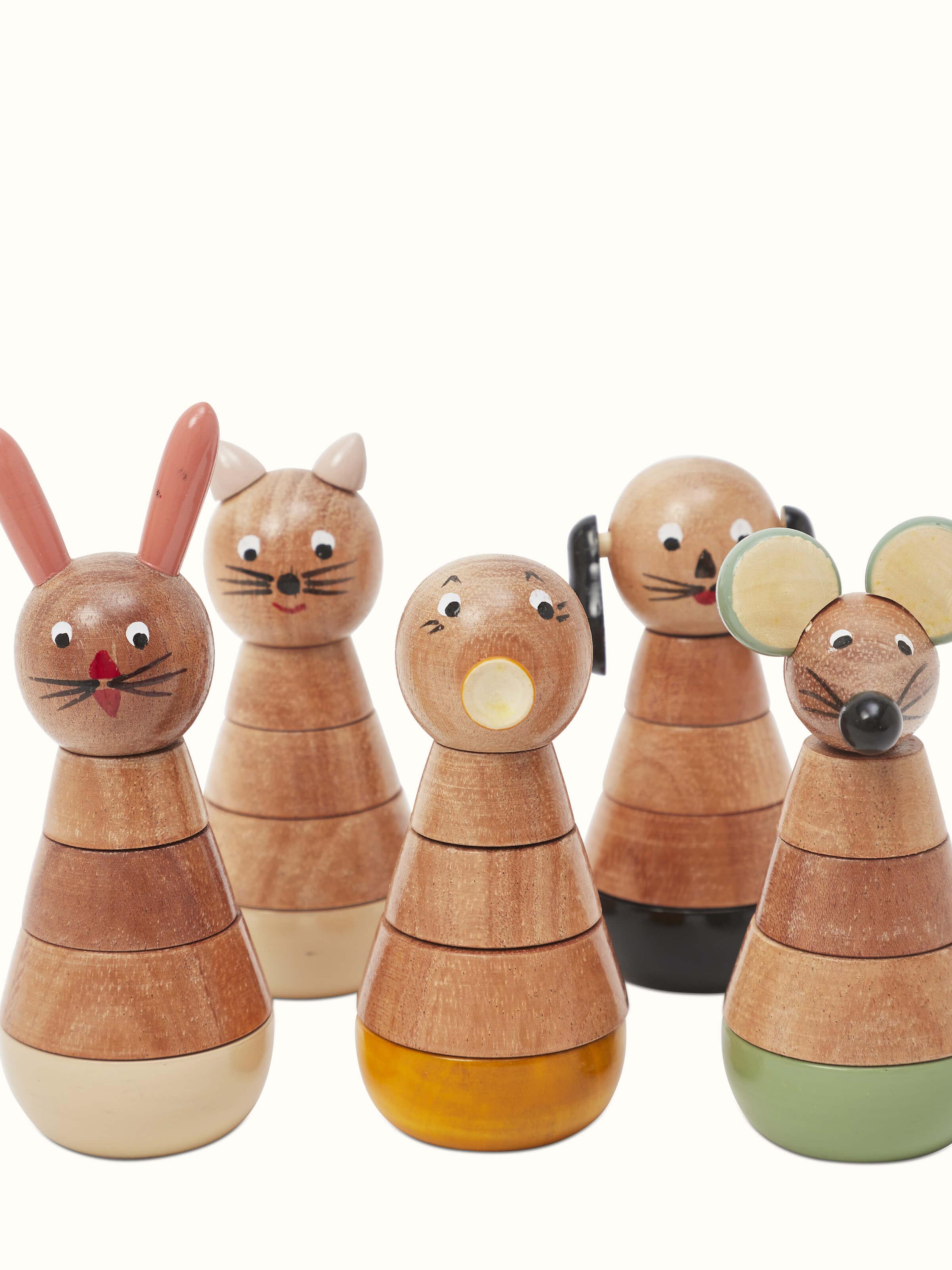 Side view of Channapatna ivory wood counting set in beige showcasing the traditional design and smooth finish.