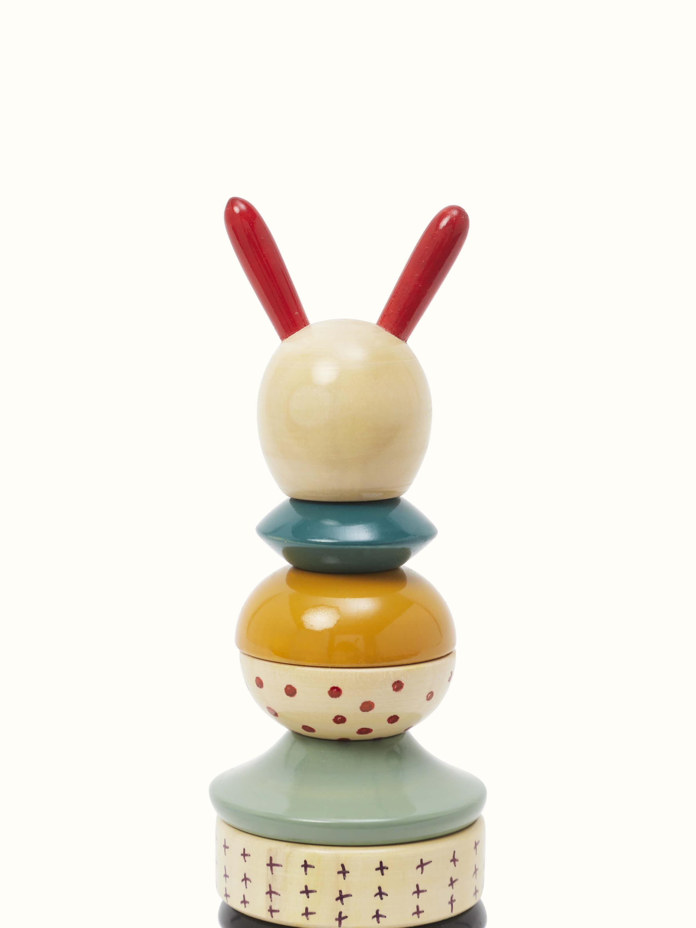 Detailed view of Channapatna ivory wood long rabbit stacking toy in white, emphasizing the wood craftsmanship
