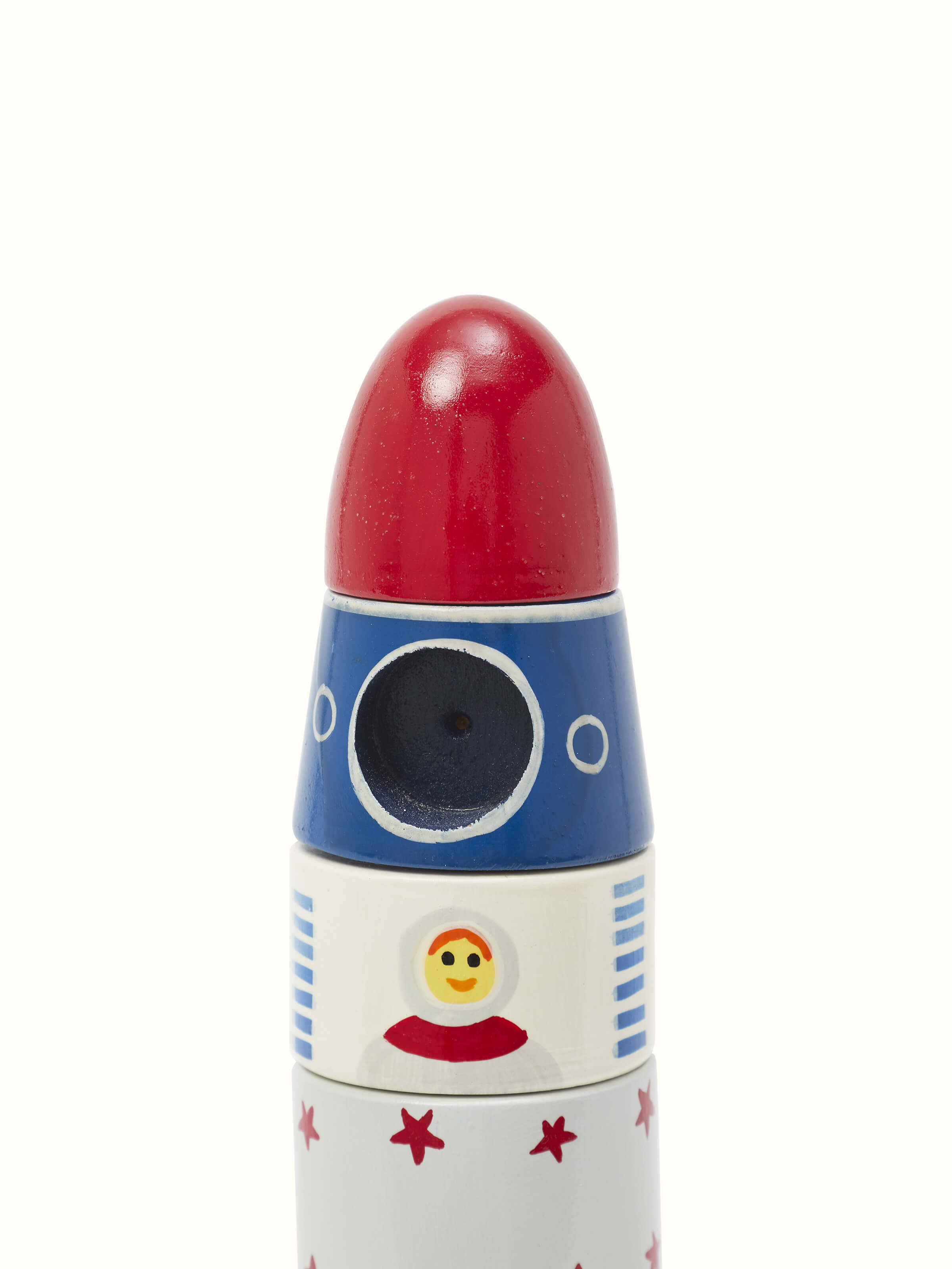 Side view of Channapatna Ivory Wood Rocket White, highlighting the rocket's shape and white wood craftsmanship