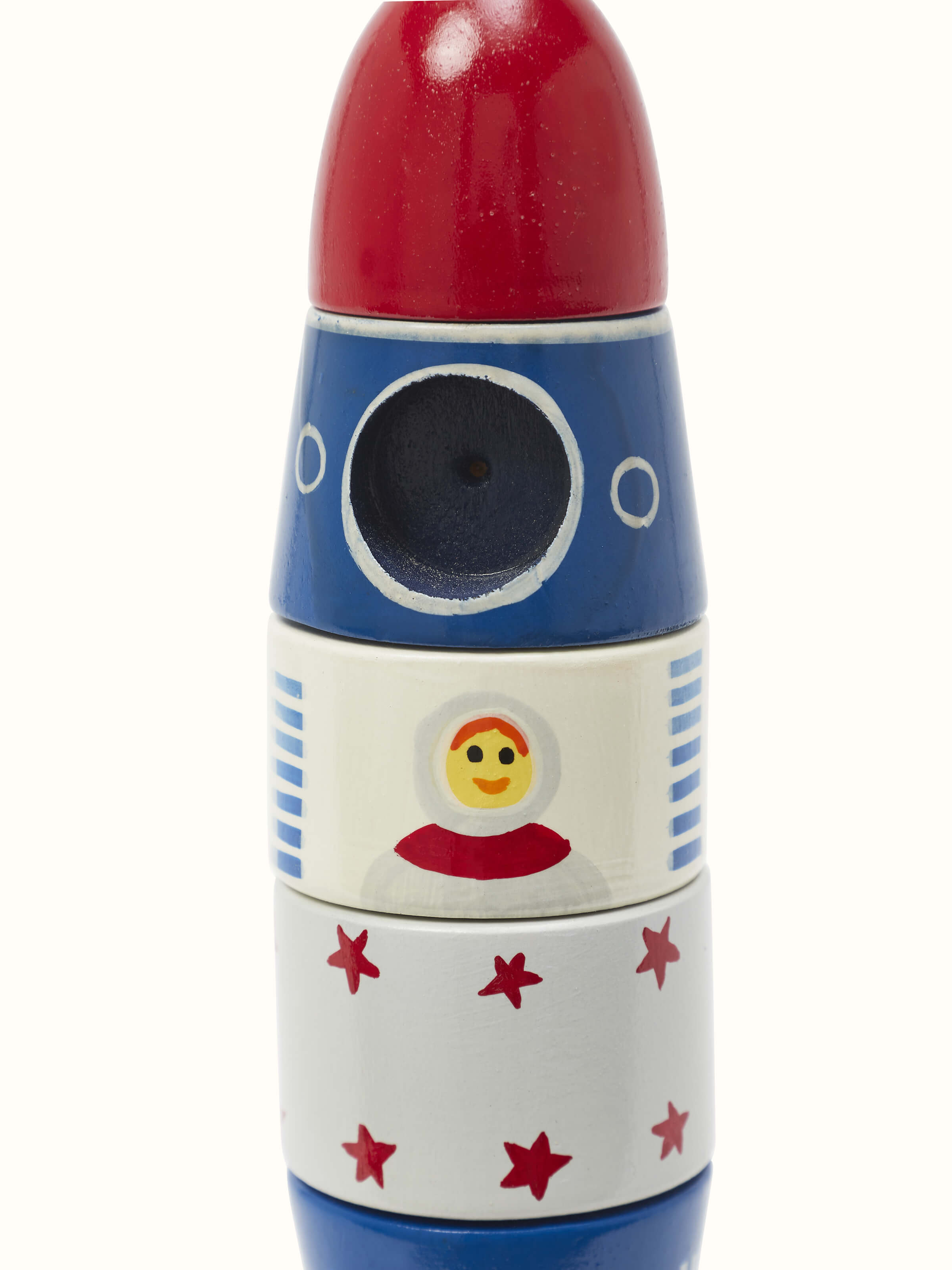 Close-up of Channapatna Ivory Wood Rocket White, focusing on the texture and carved details