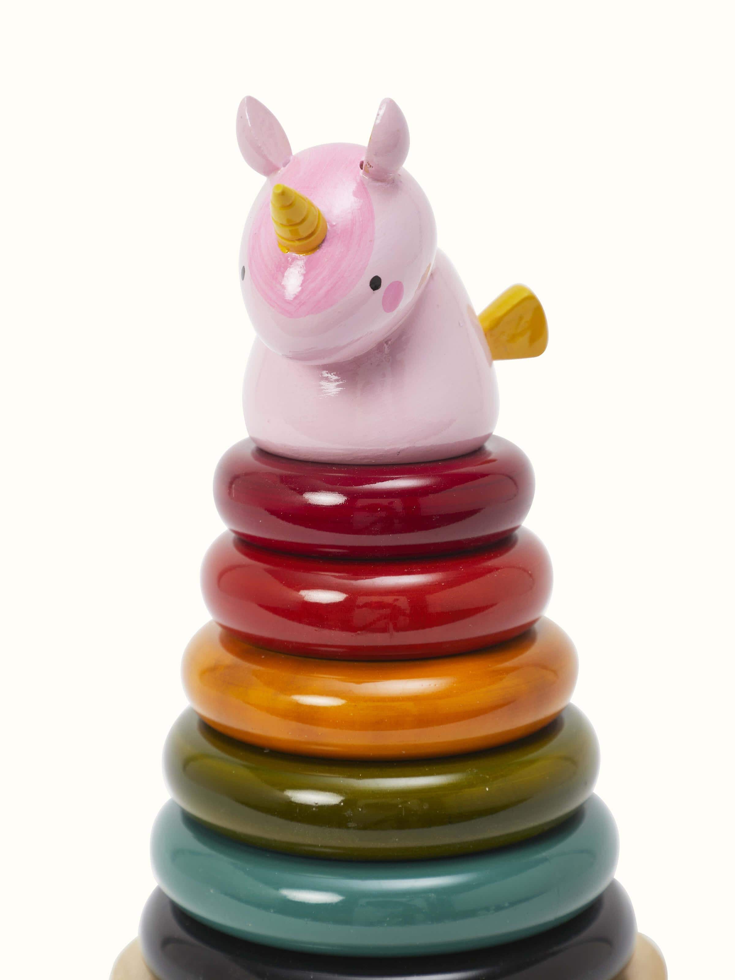 Side view of Channapatna ivory wood unicorn emphasizing its elegant shape and finish