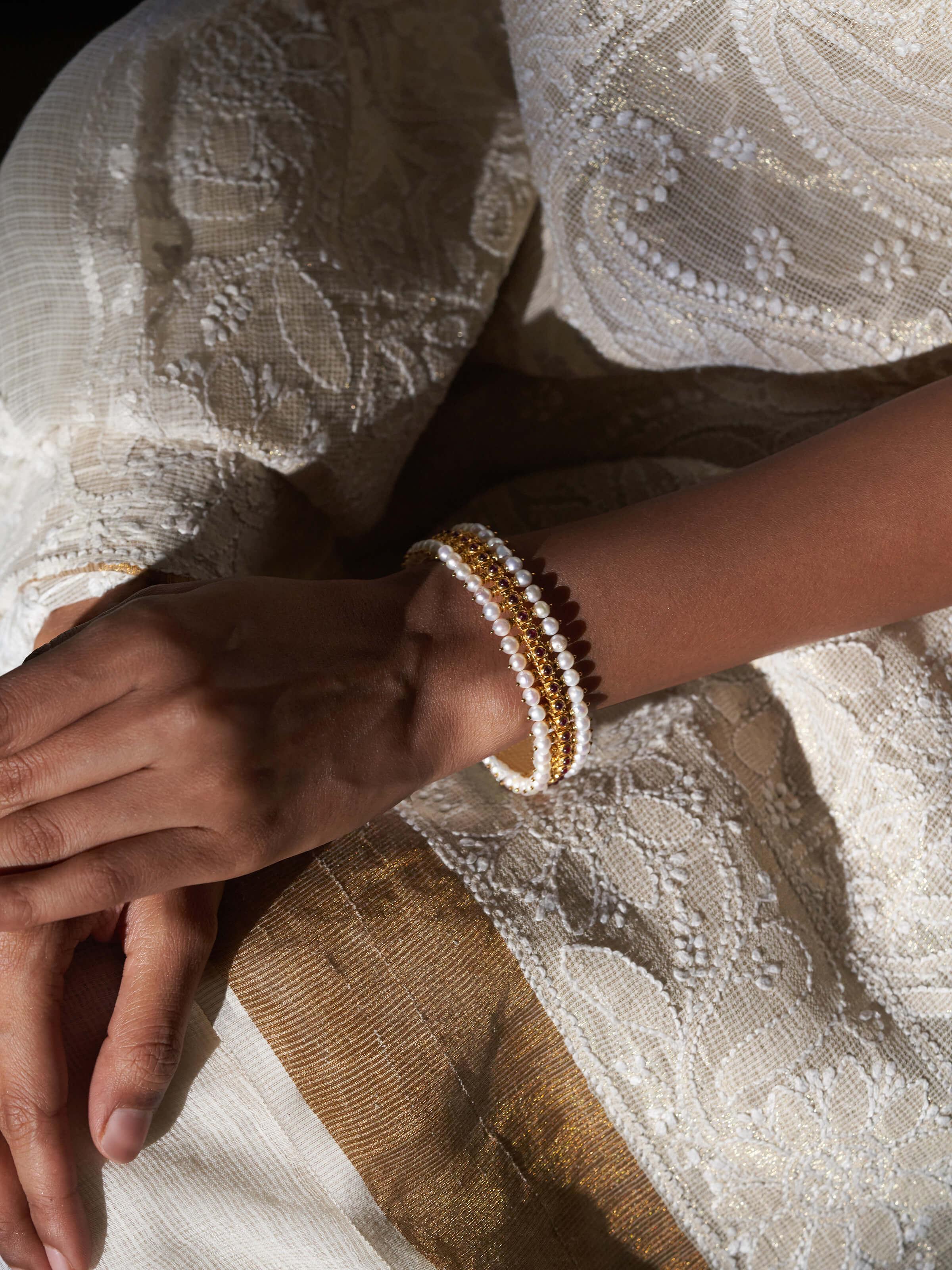 Close-up view of Guttapusalu silver bangle focusing on its ornate design and traditional detailing