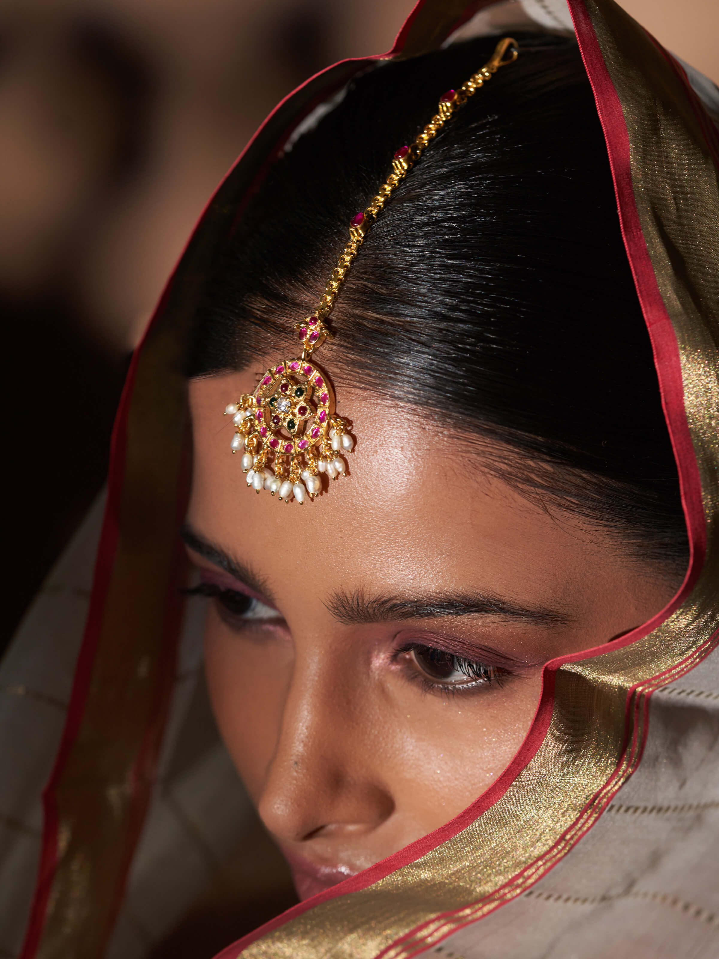 Alternate side view of Guttapusalu silver maangtika displaying delicate ornamentation