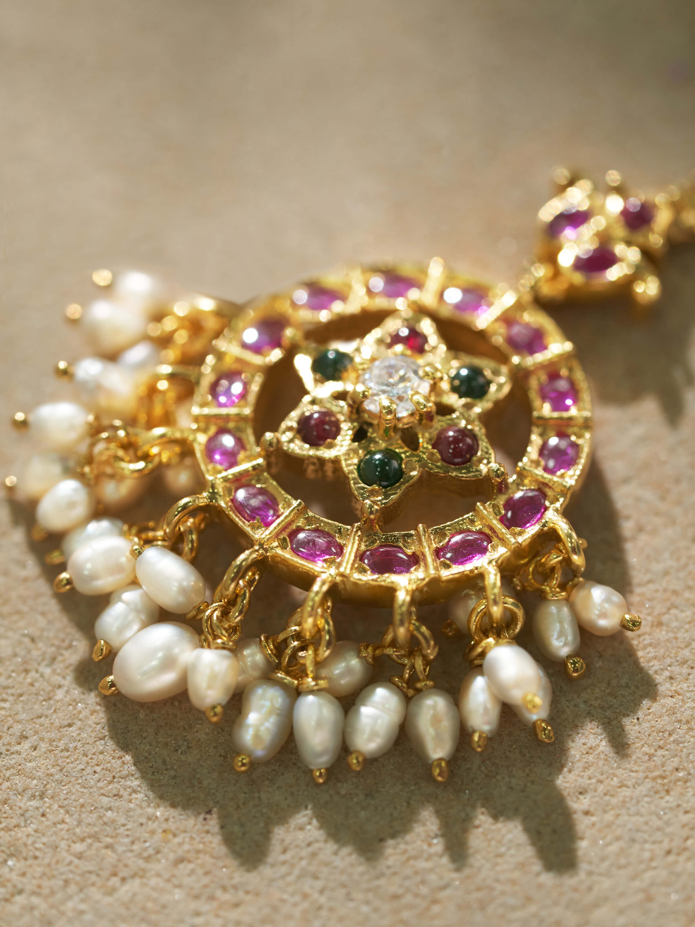 Angled view of Guttapusalu silver maangtika highlighting its elegant drape and intricate design