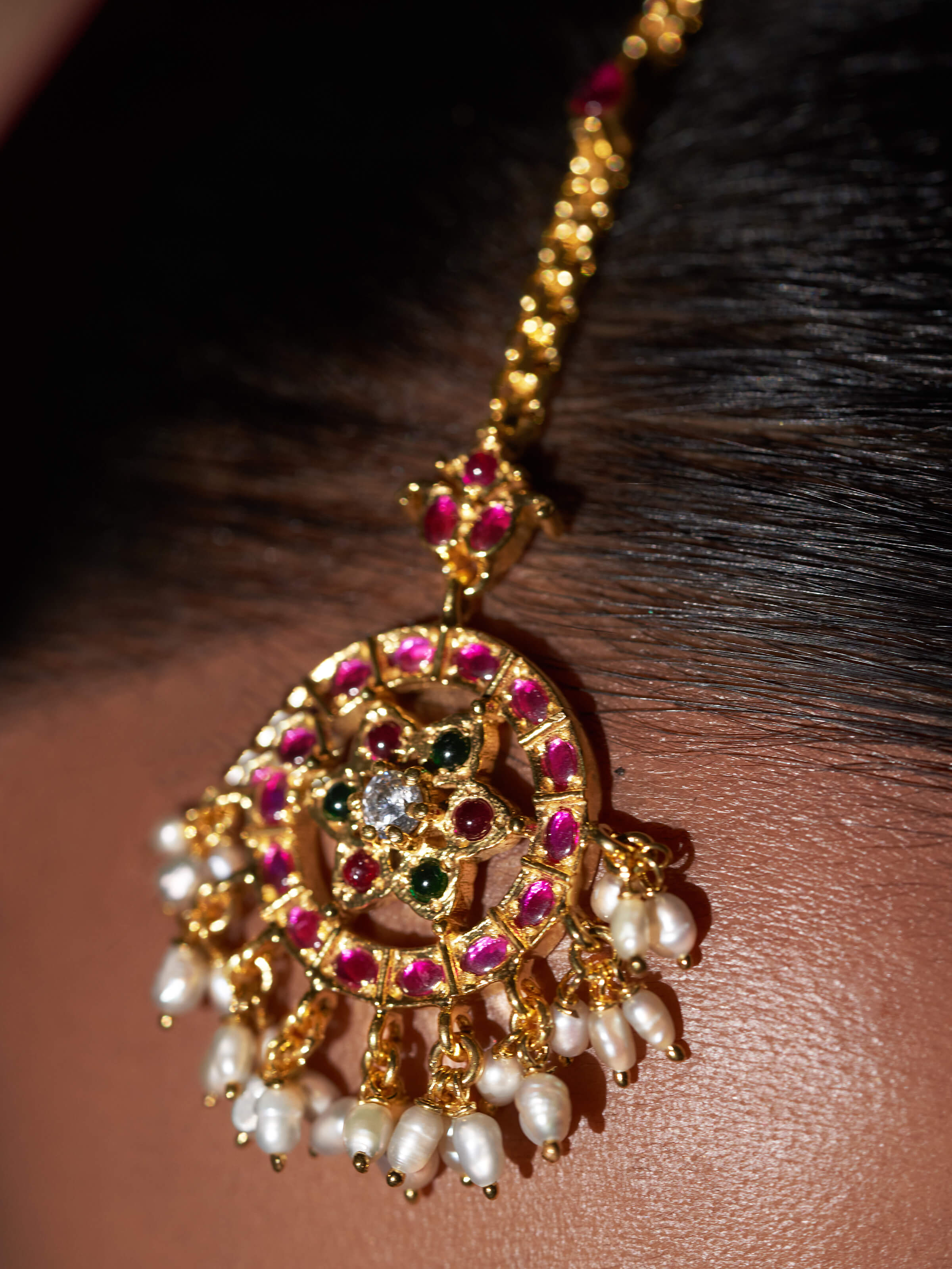 Detailed view of Guttapusalu silver maangtika showing refined metalwork and traditional style