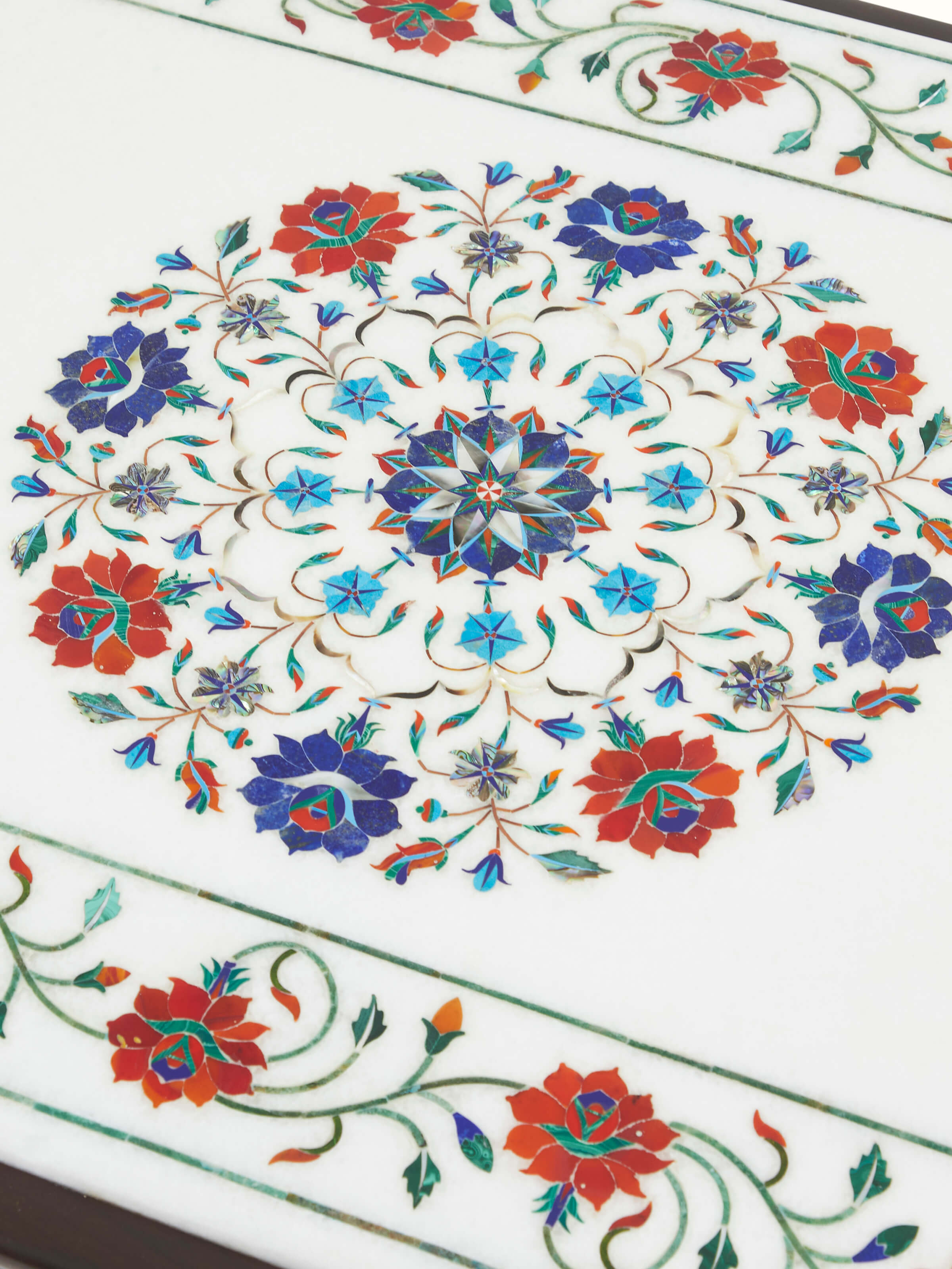 Detailed view of the Sheesham wood frame and marble top of the coffee table, showcasing the quality of craftsmanship.